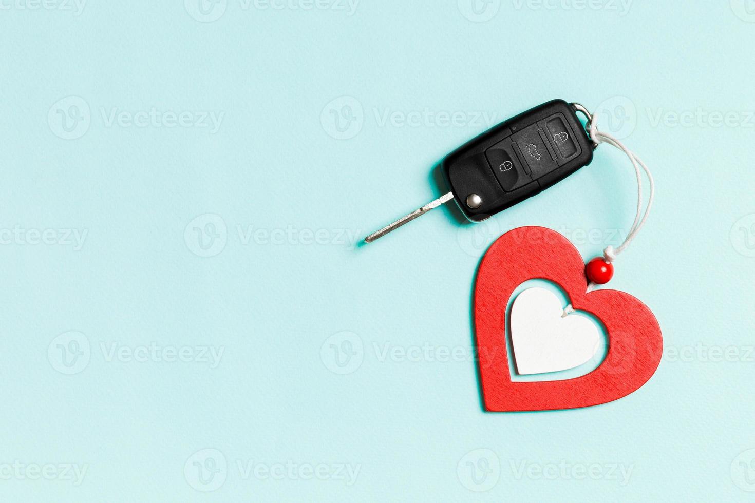 Top view of gift box and wooden heart on colorful background. Luxury present for Valentine's day photo