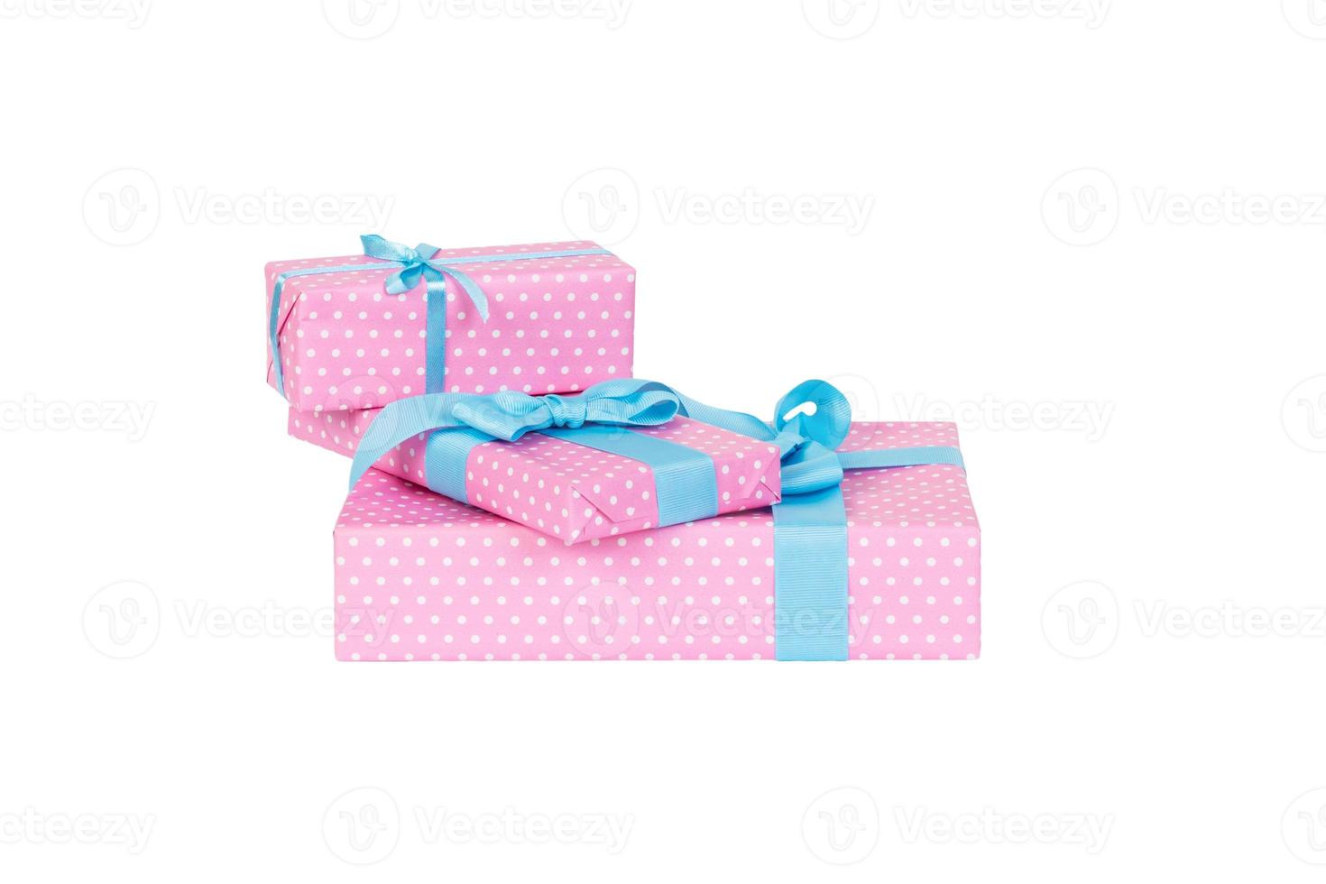 Set of Christmas or other holiday handmade present in pink paper with blue ribbon. Isolated on white background, top view. thanksgiving Gift box concept photo