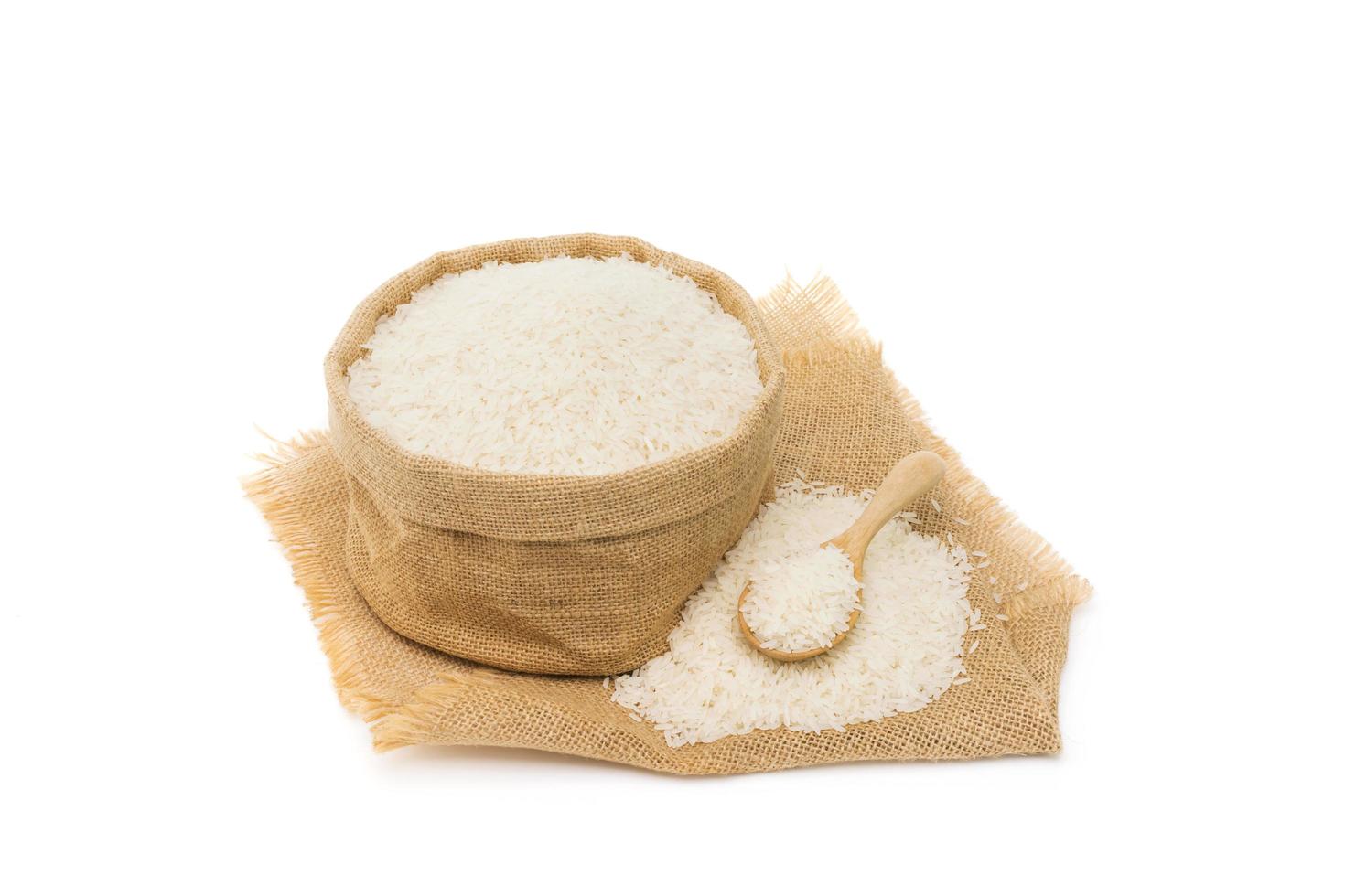 top view of rice flour wheat in a bag and ears of rice isolated on a white background photo