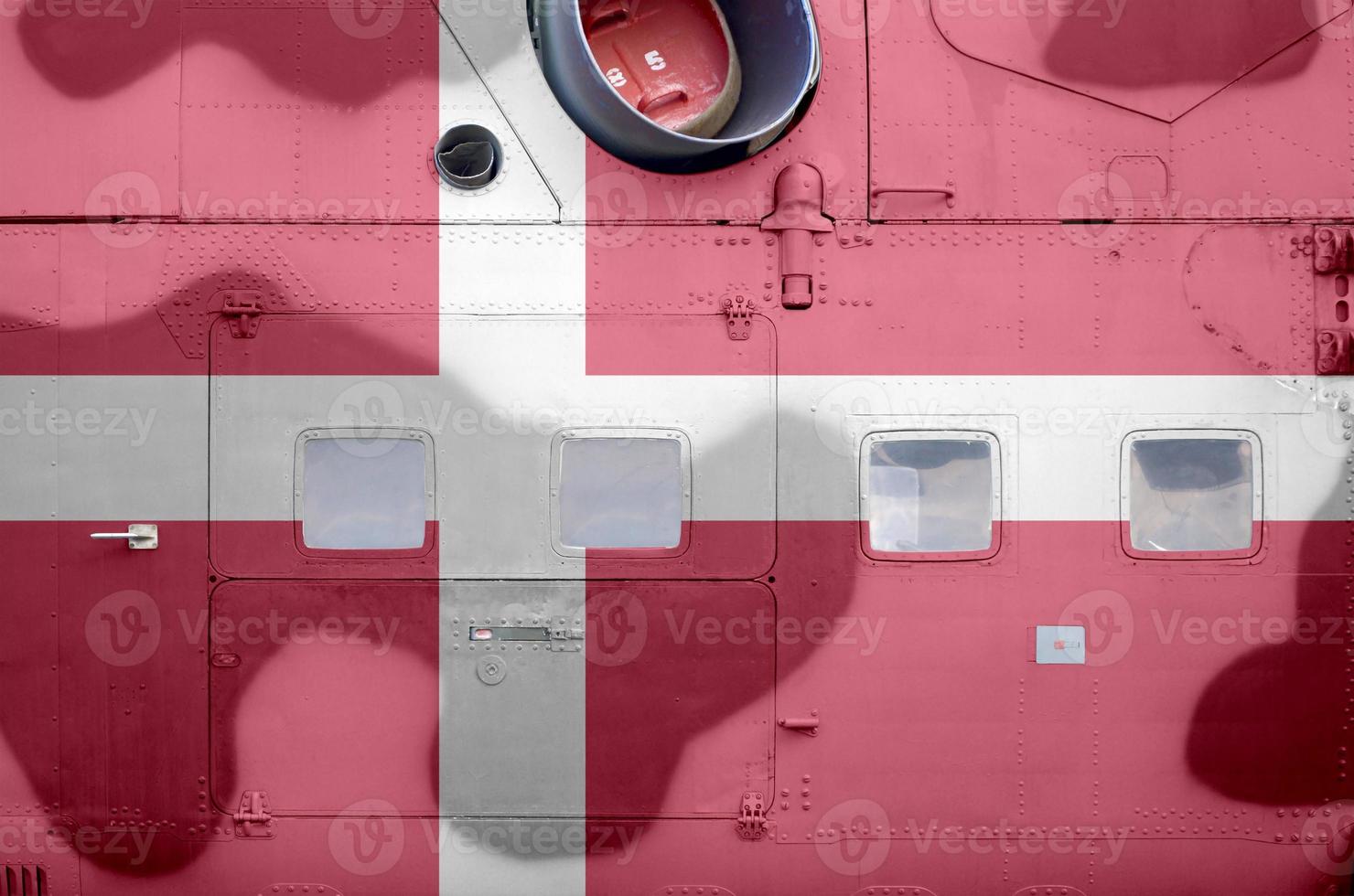 Denmark flag depicted on side part of military armored helicopter closeup. Army forces aircraft conceptual background photo