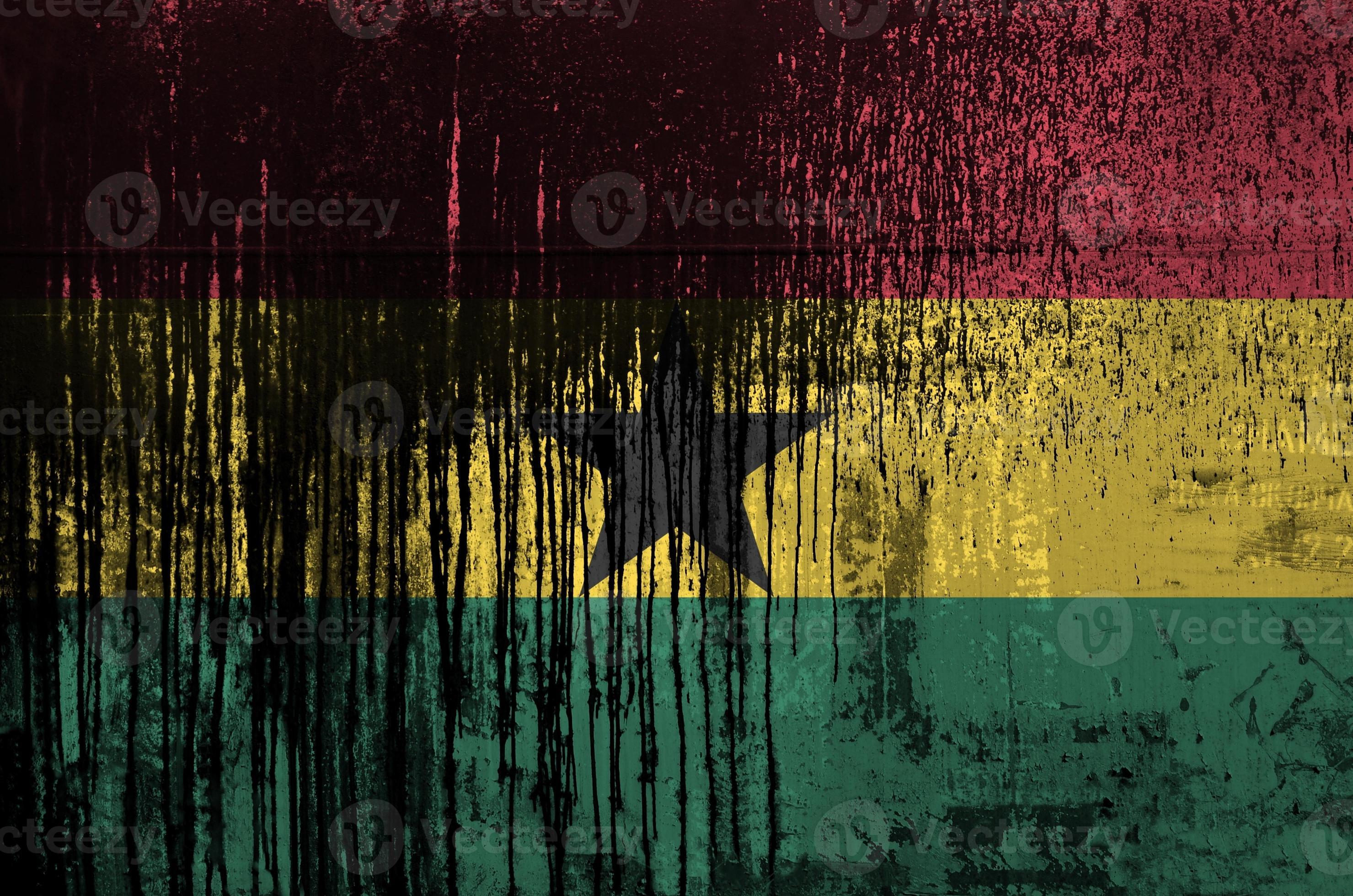 Ghana flag depicted in paint colors on old and dirty oil barrel wall