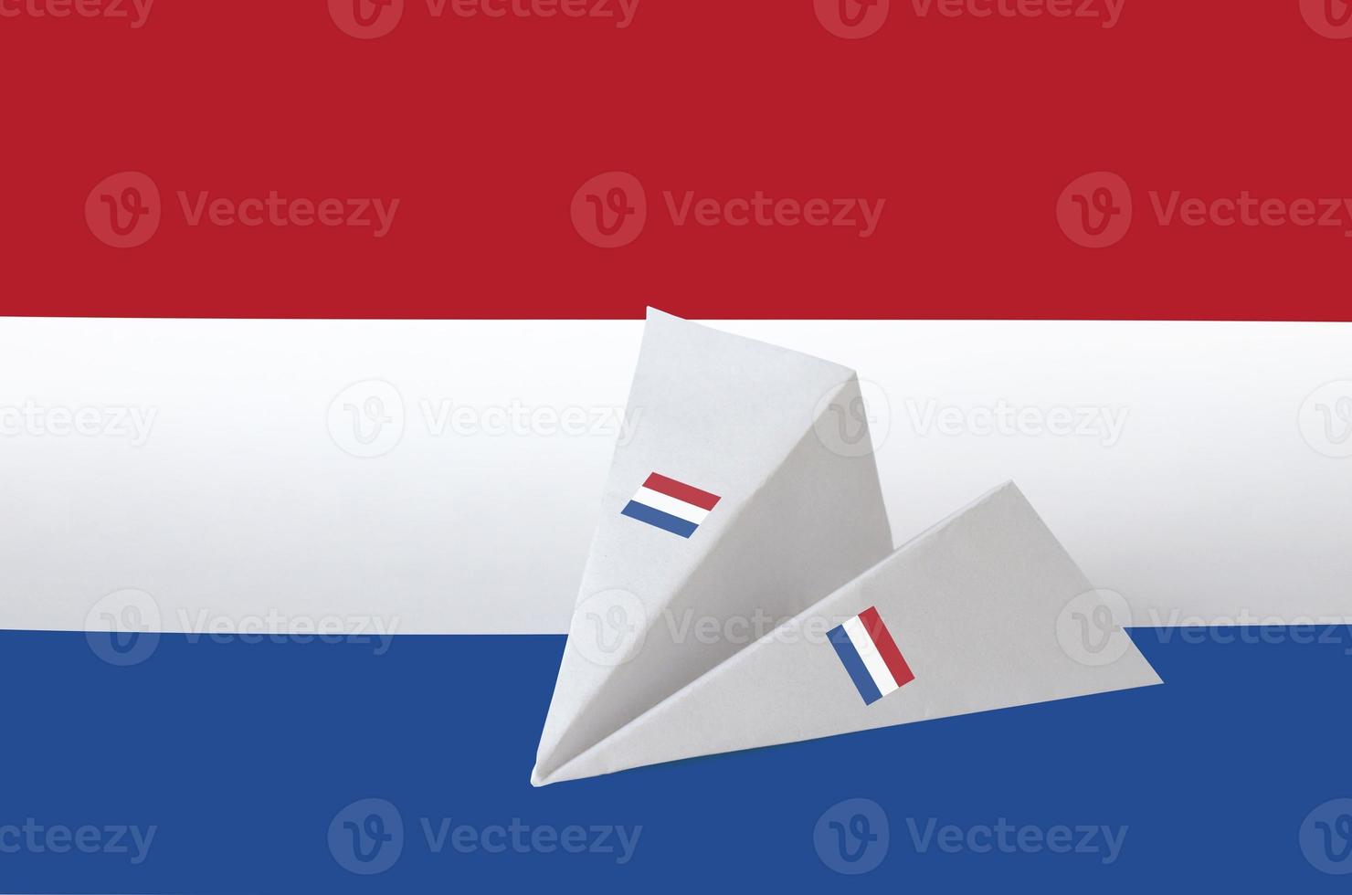 Netherlands flag depicted on paper origami airplane. Handmade arts concept photo