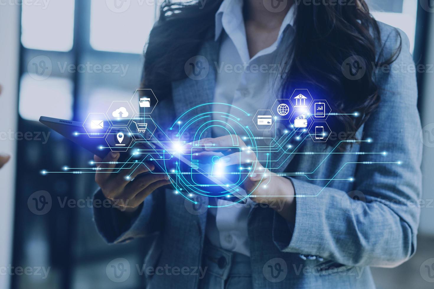 Cybersecurity and privacy concepts to protect data. Lock icon and internet network security technology. Businessman protecting personal data on smart phone with virtual screen interfaces. photo