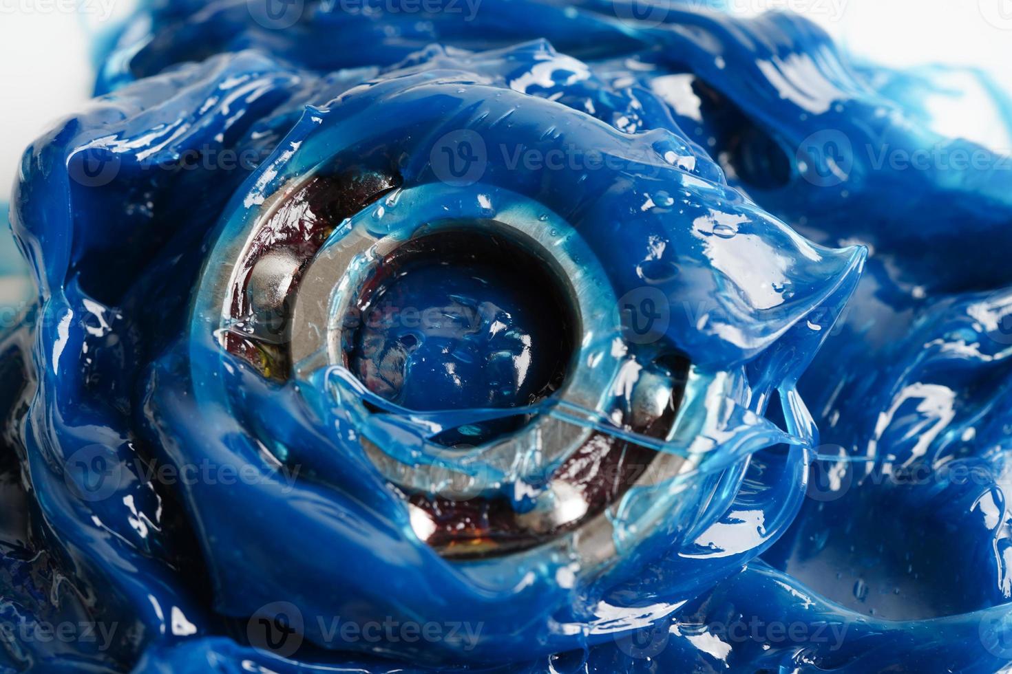 Grease and ball bearing, Blue premium quality synthetic lithium complex grease, high temperatures and machinery lubrication for automotive and industrial. photo