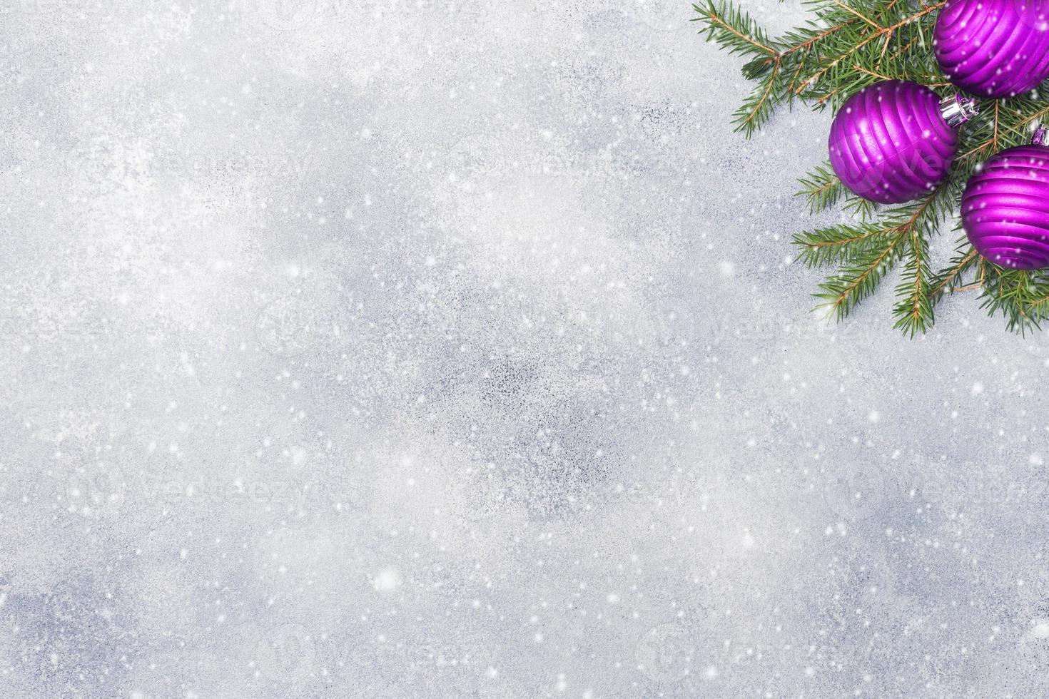 Christmas scenery, toys and branches fir on grey background. New Year concept Copy space photo