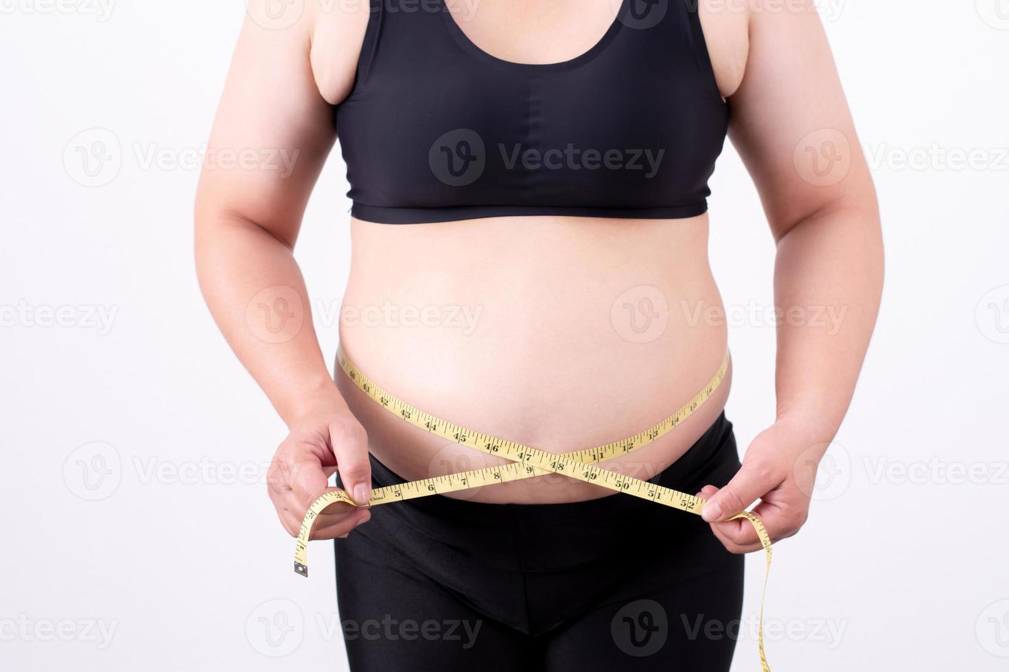 Fat women measure belly fat. Health care, medical concepts. photo