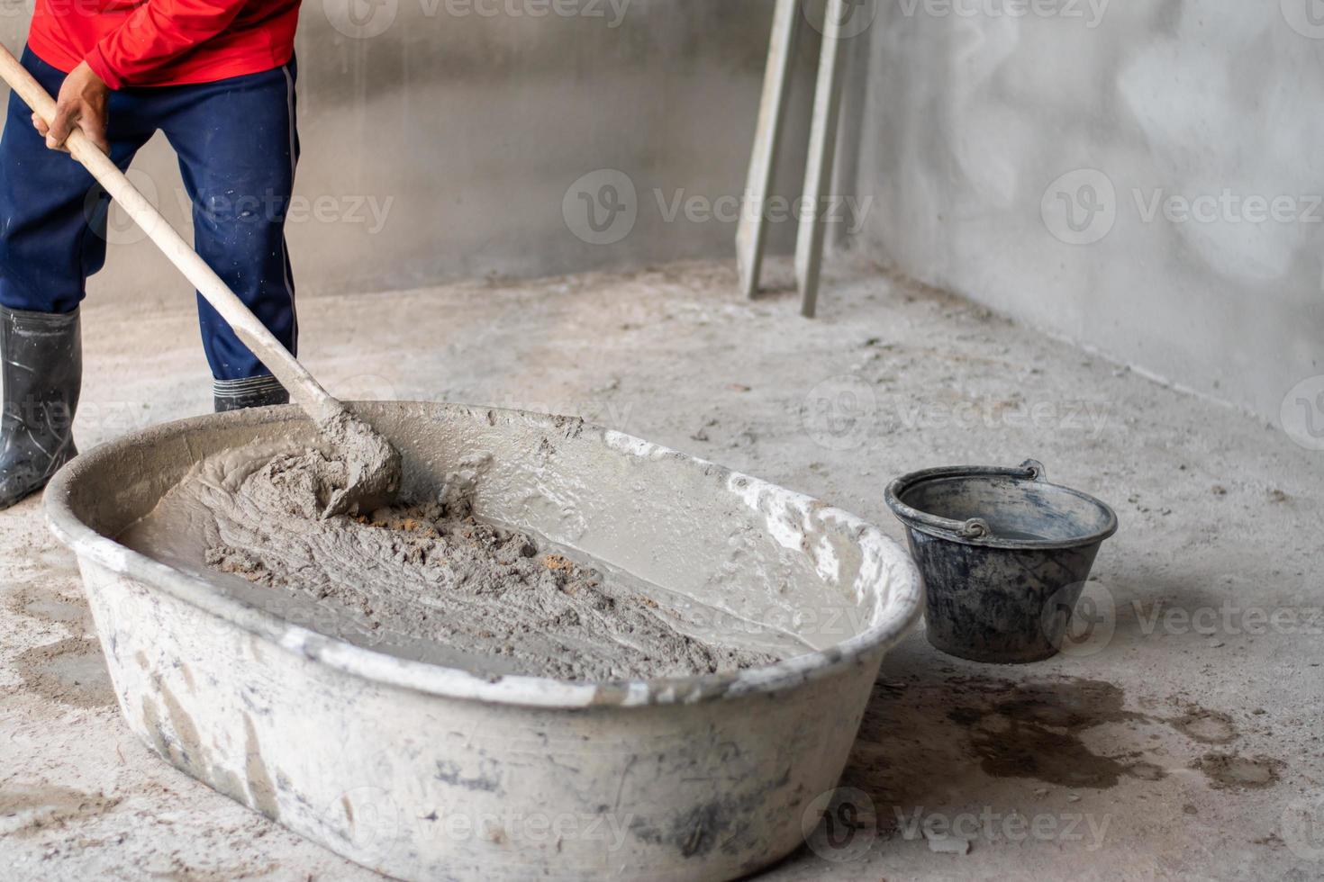 Construction workers mix cement in large tanks 14980529 Stock Photo at Vecteezy