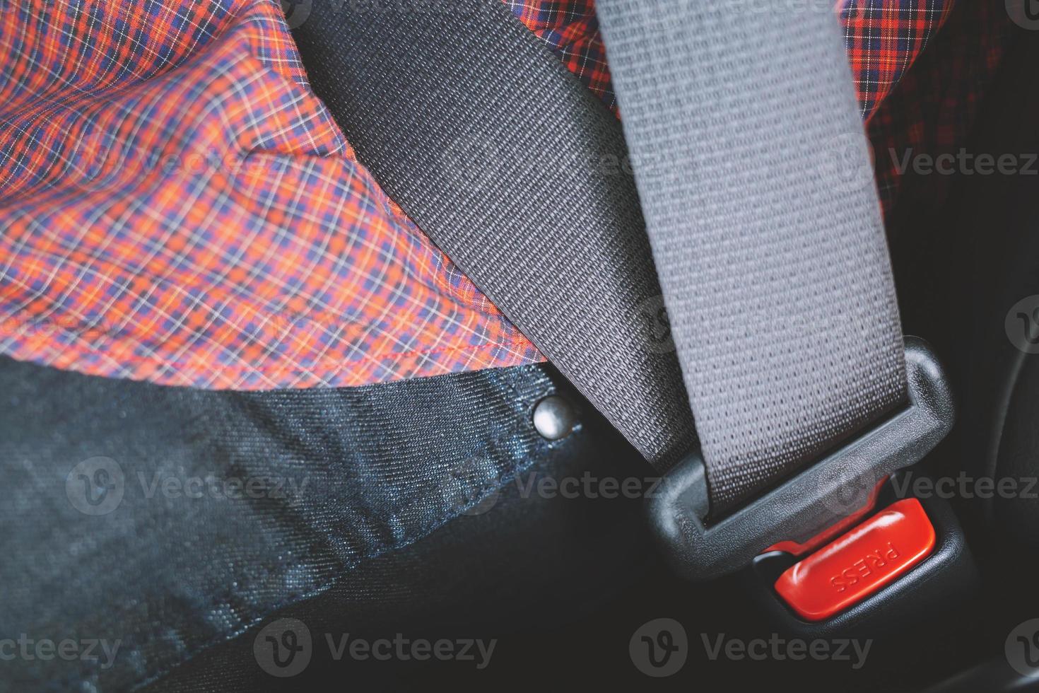 Close Up of people hand fastening seat safety belt in car for safety before driving on the road. concept transport travel. photo
