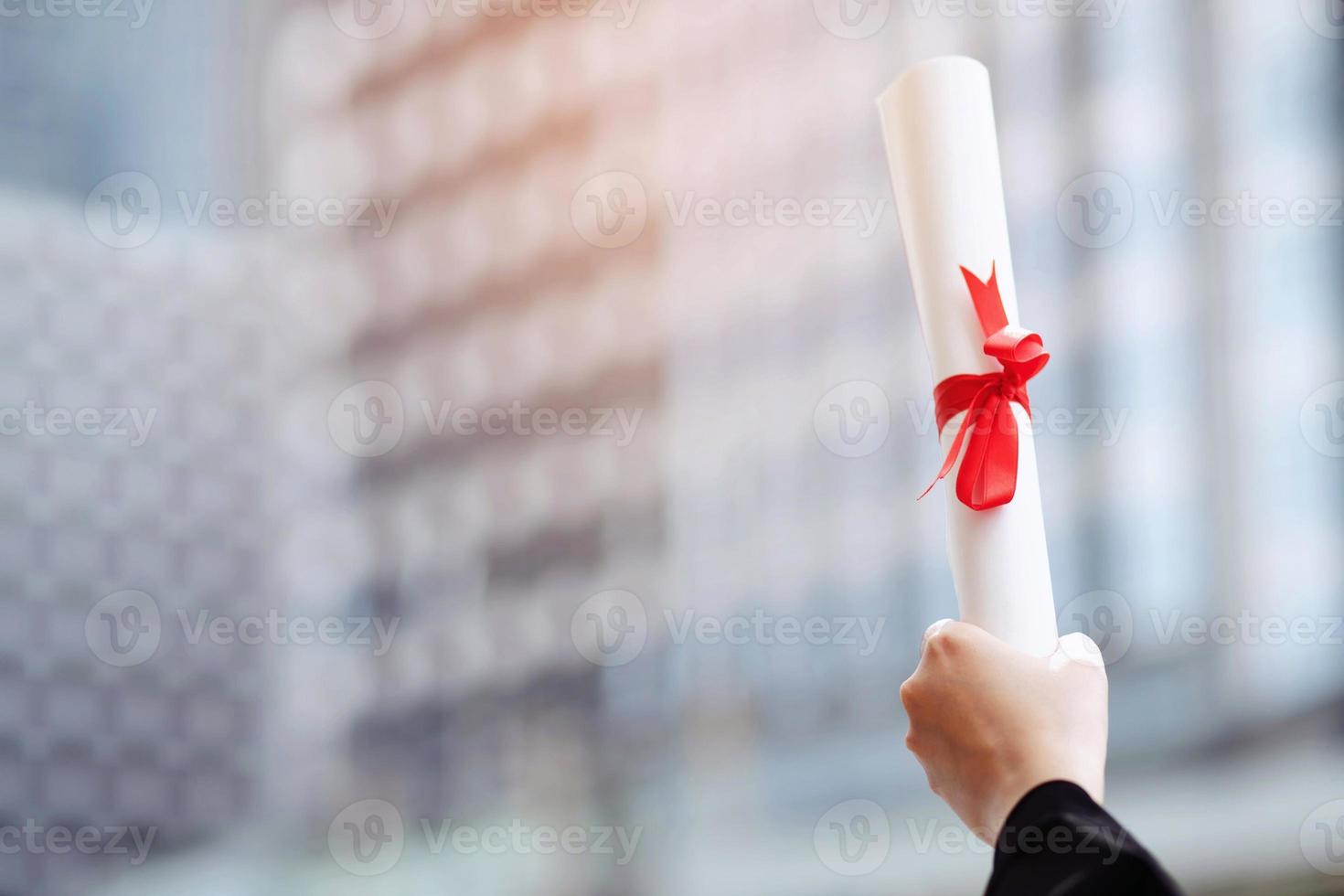 graduates holding diplomas congratulating photo