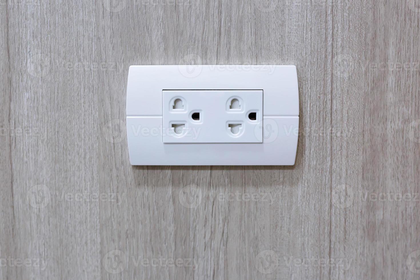 Plug Into Electricity Socket the power outlets on the wood wall photo