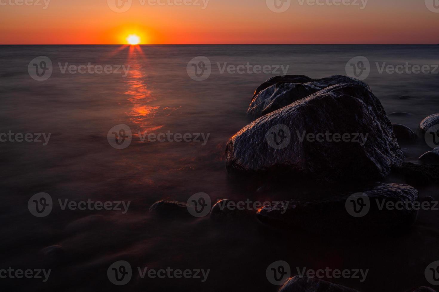 Stones on The Coast of The Baltic Sea at Sunset photo