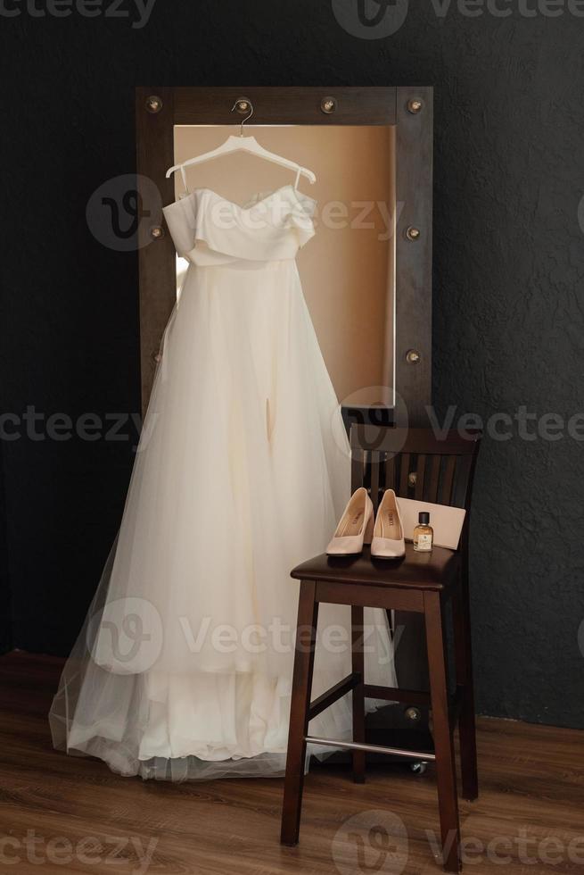 dress up the bride in a wedding dress with corset and lacing photo