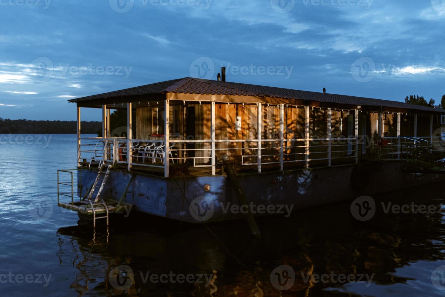 barge-based floating hotel on the river photo