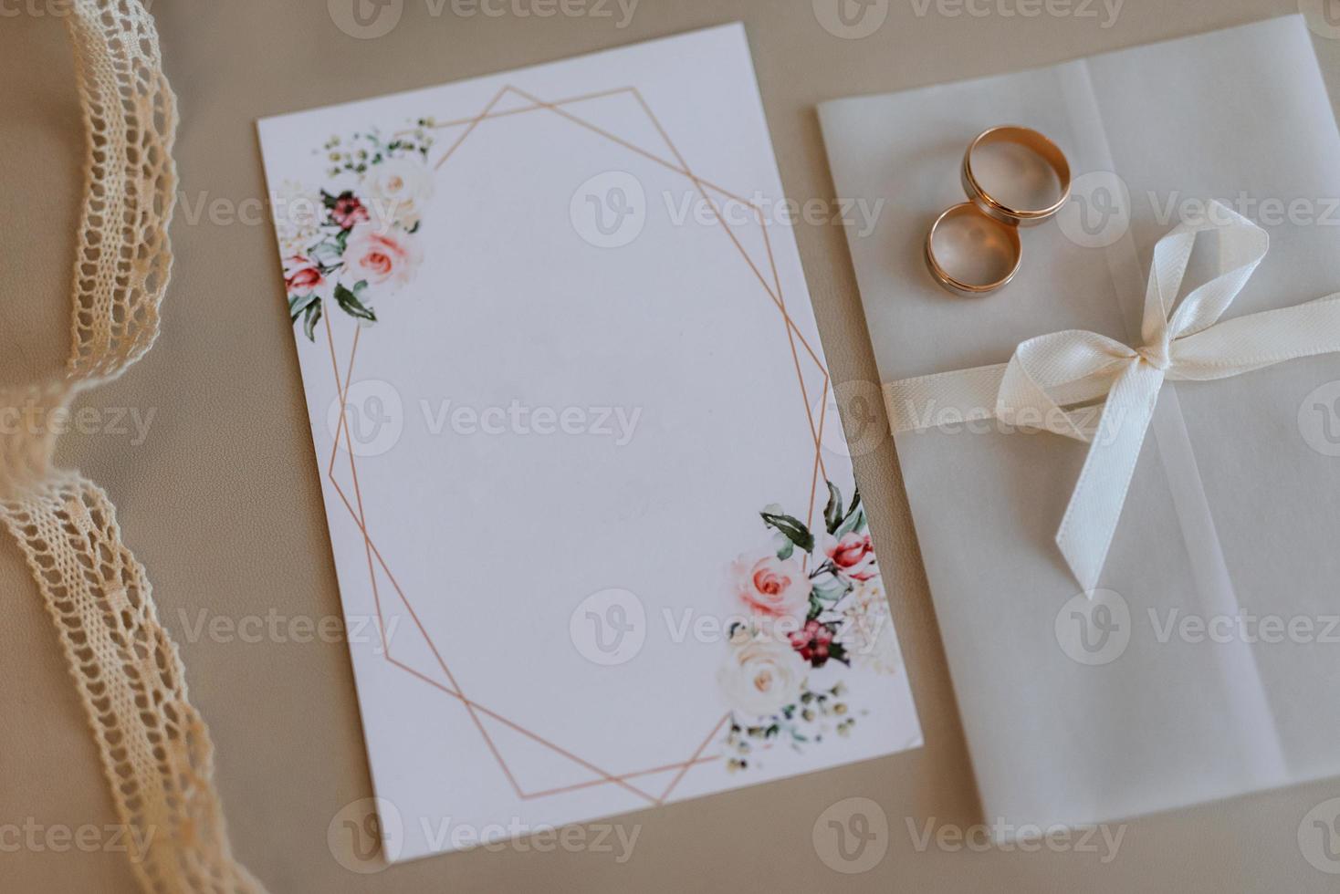 wedding invitation in a gray envelope on a table photo