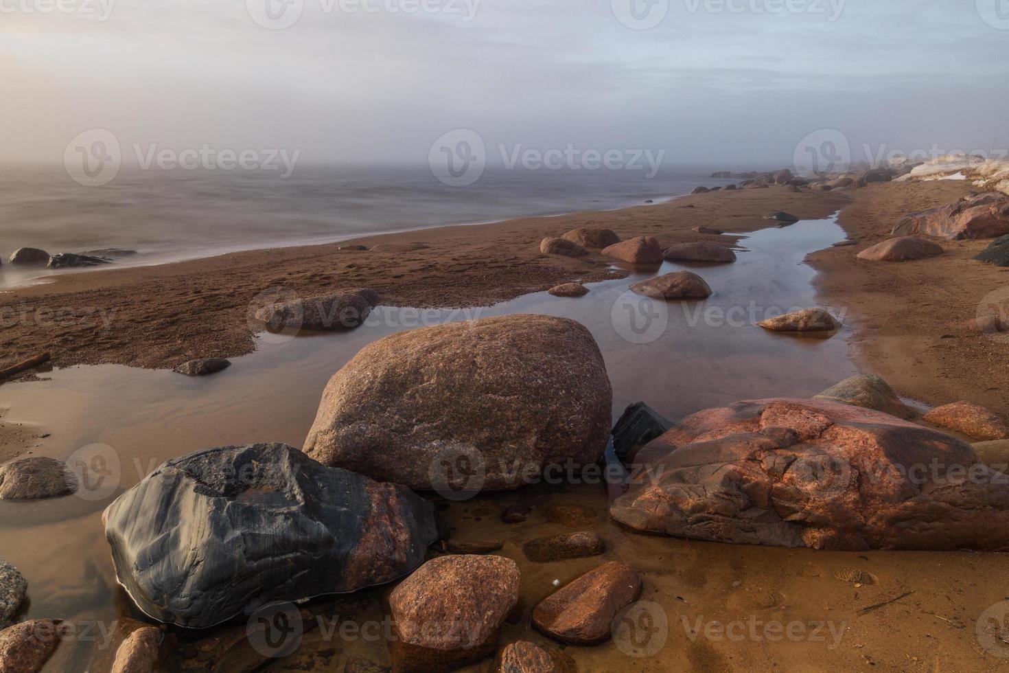 Stones on The Coast of the Baltic Sea at Sunset photo