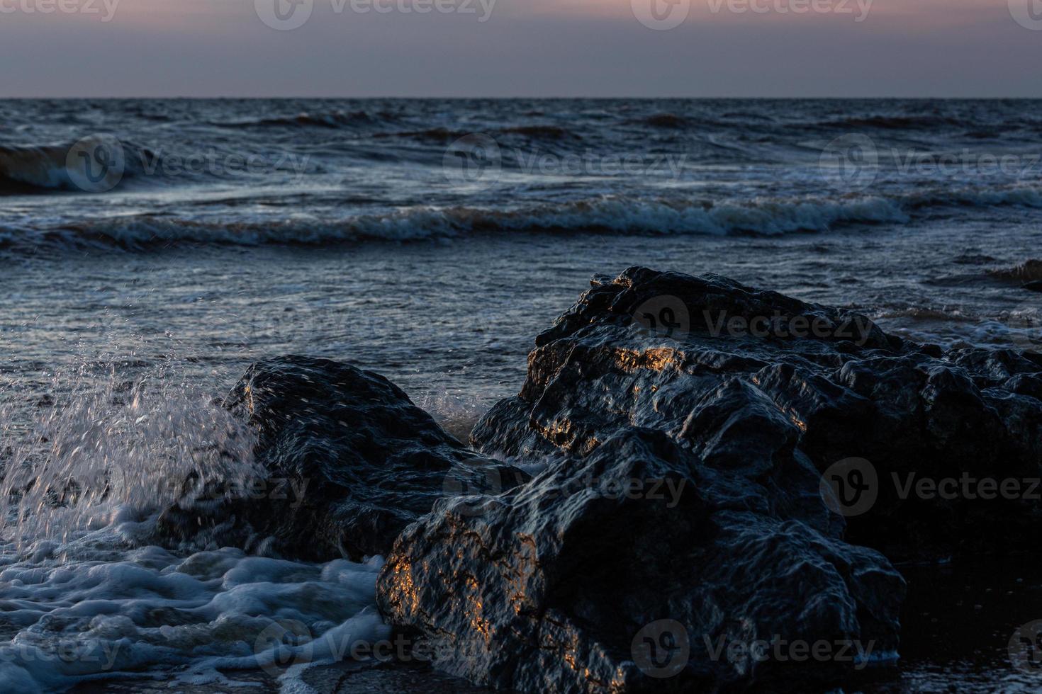 Stones on The Coast of The Baltic Sea at Sunset photo