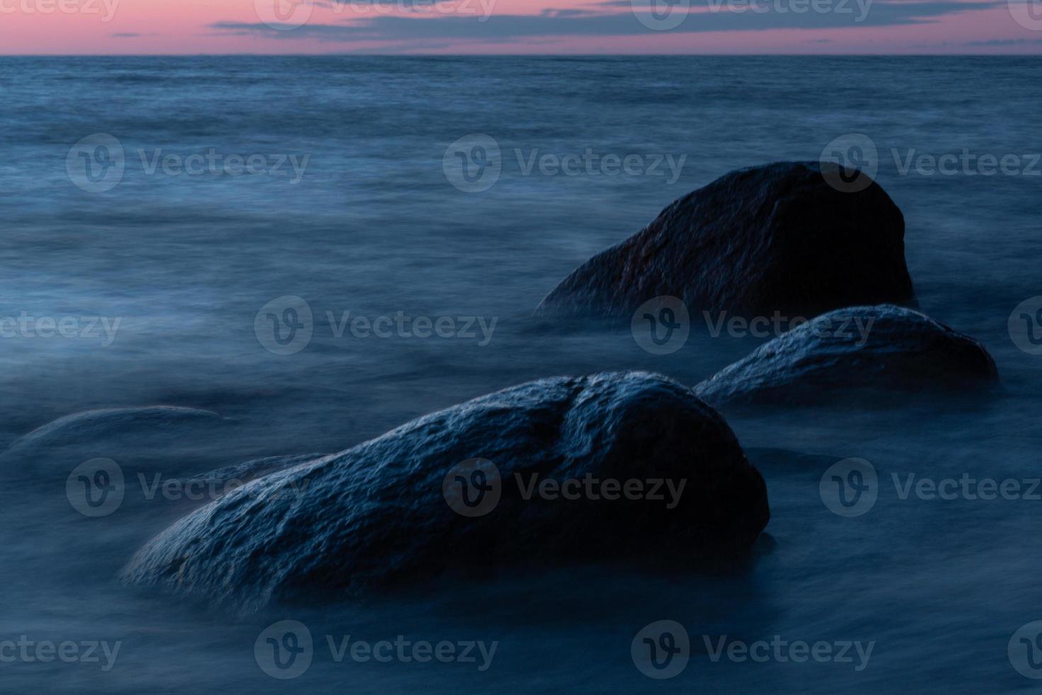 Stones on The Coast of The Baltic Sea at Sunset photo