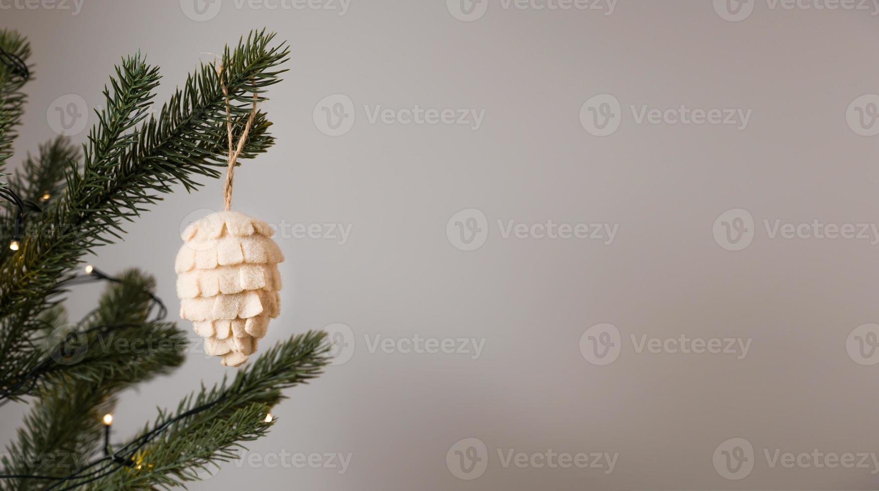 Pine cone toy for fir tree made of natural materials. Zero waste christmas concept.Banner with place for text photo