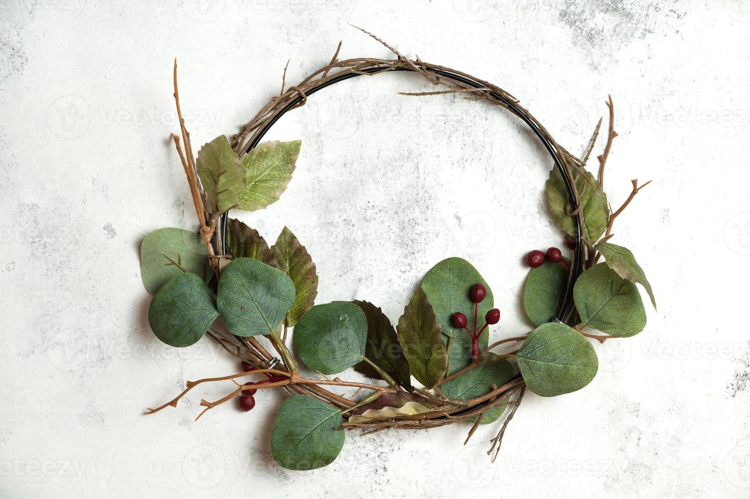 Christmas, winter, new year concept. Flat lay, top view on christmas wreath made of eucalyptus branches photo