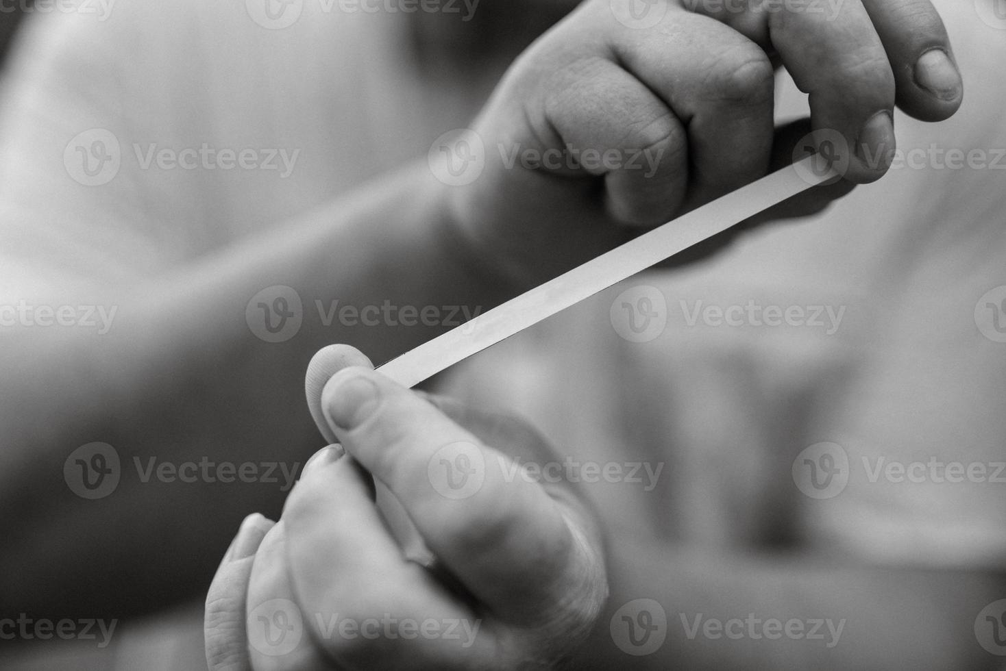 hands with paper tape photo