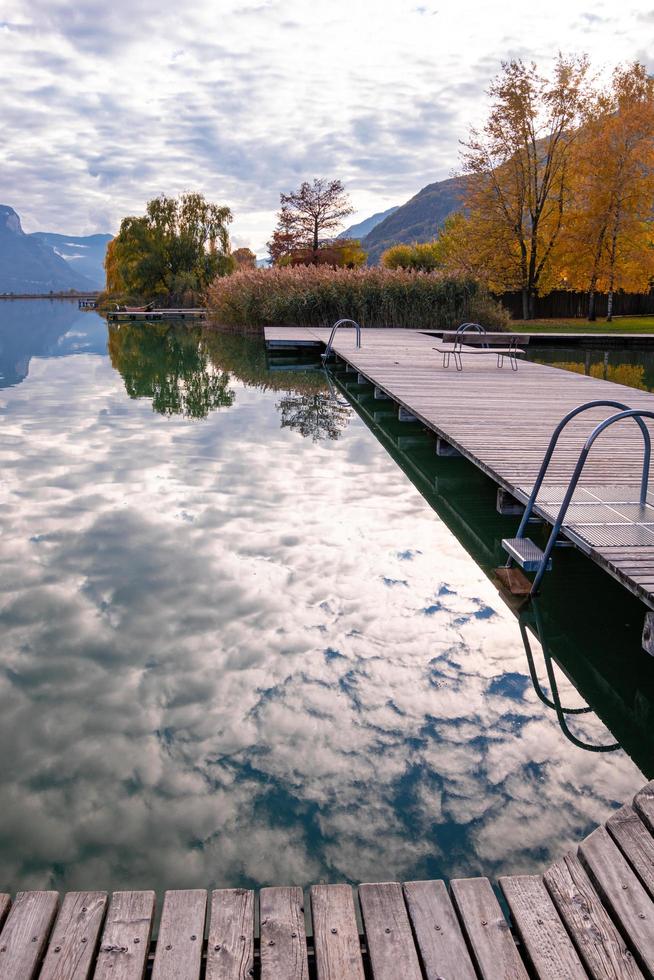 Kaltern, South Tyrol, Italy -14 November 2022 Landing stage at Lake Caldaro, a natural bathing lake on the South Tyrolean Wine Road photo