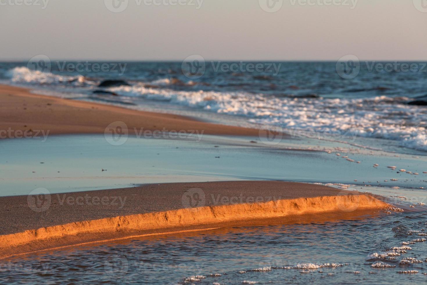 Stones on The Coast of The Baltic Sea at Sunset photo