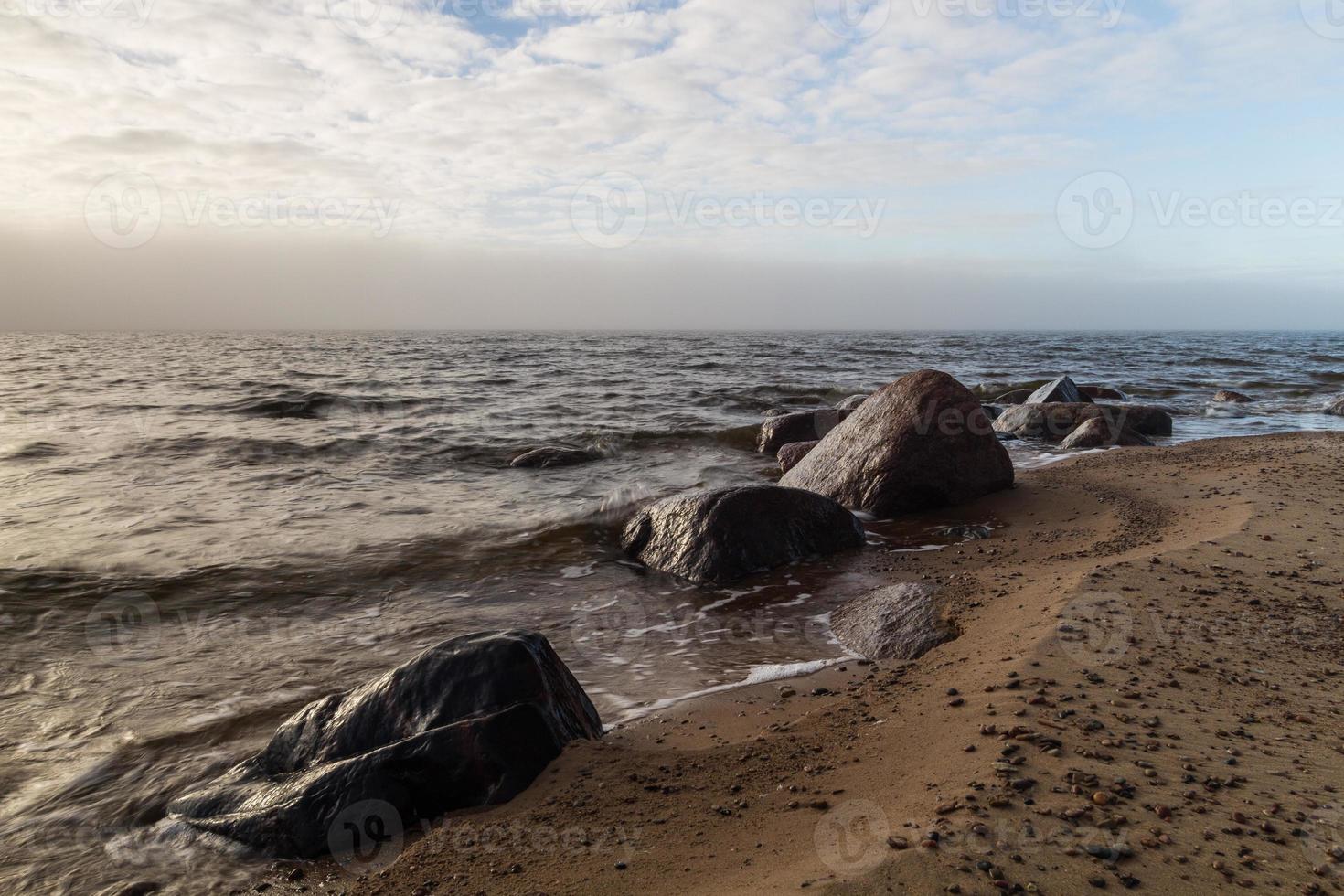 Stones on The Coast of the Baltic Sea at Sunset photo