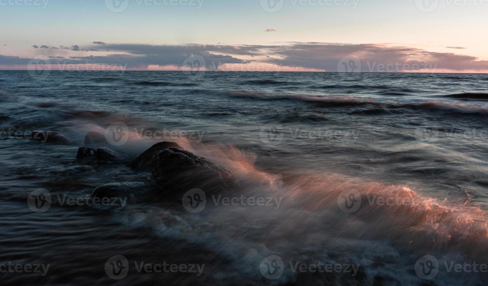 Stones on The Coast of The Baltic Sea at Sunset photo