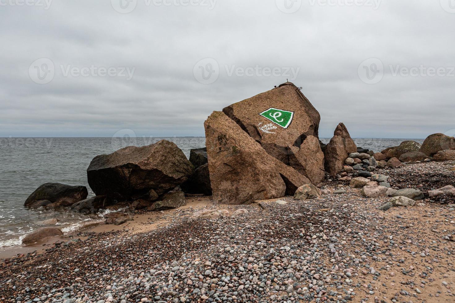 Baltic Sea Coast With Pebbles And Ice at Sunset photo