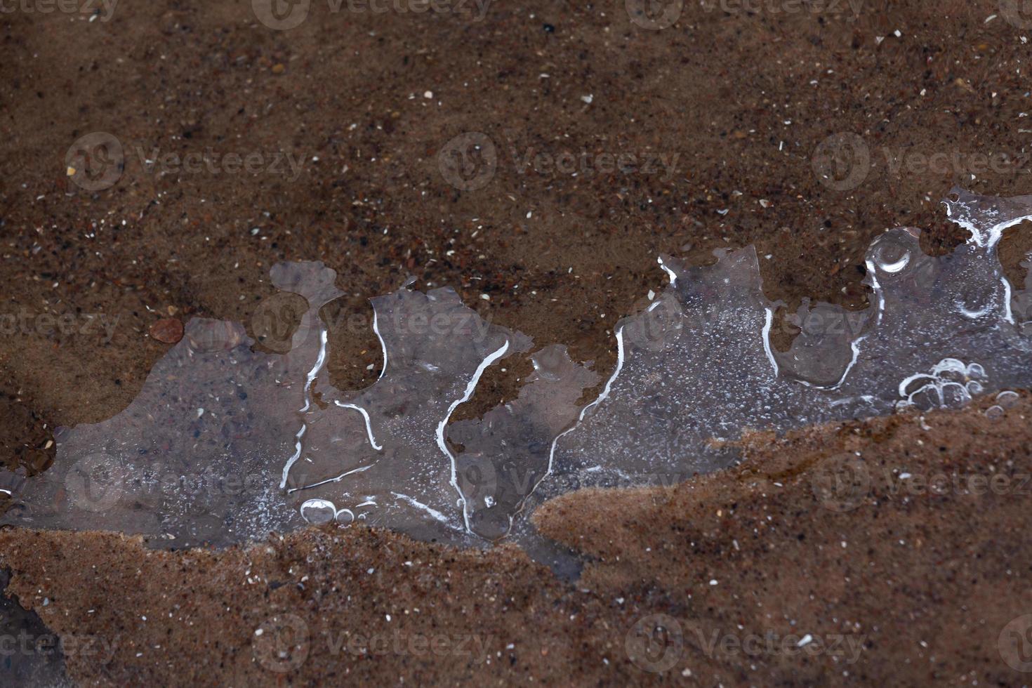 Baltic Sea Coast With Pebbles And Ice at Sunset photo