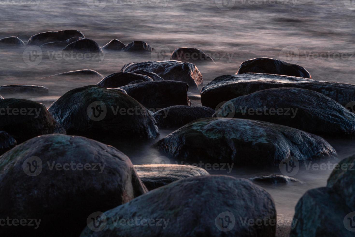 Stones on The Coast of The Baltic Sea at Sunset photo