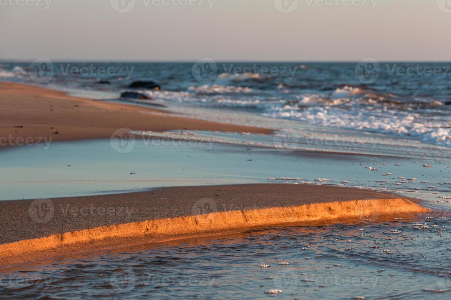 Stones on The Coast of The Baltic Sea at Sunset photo