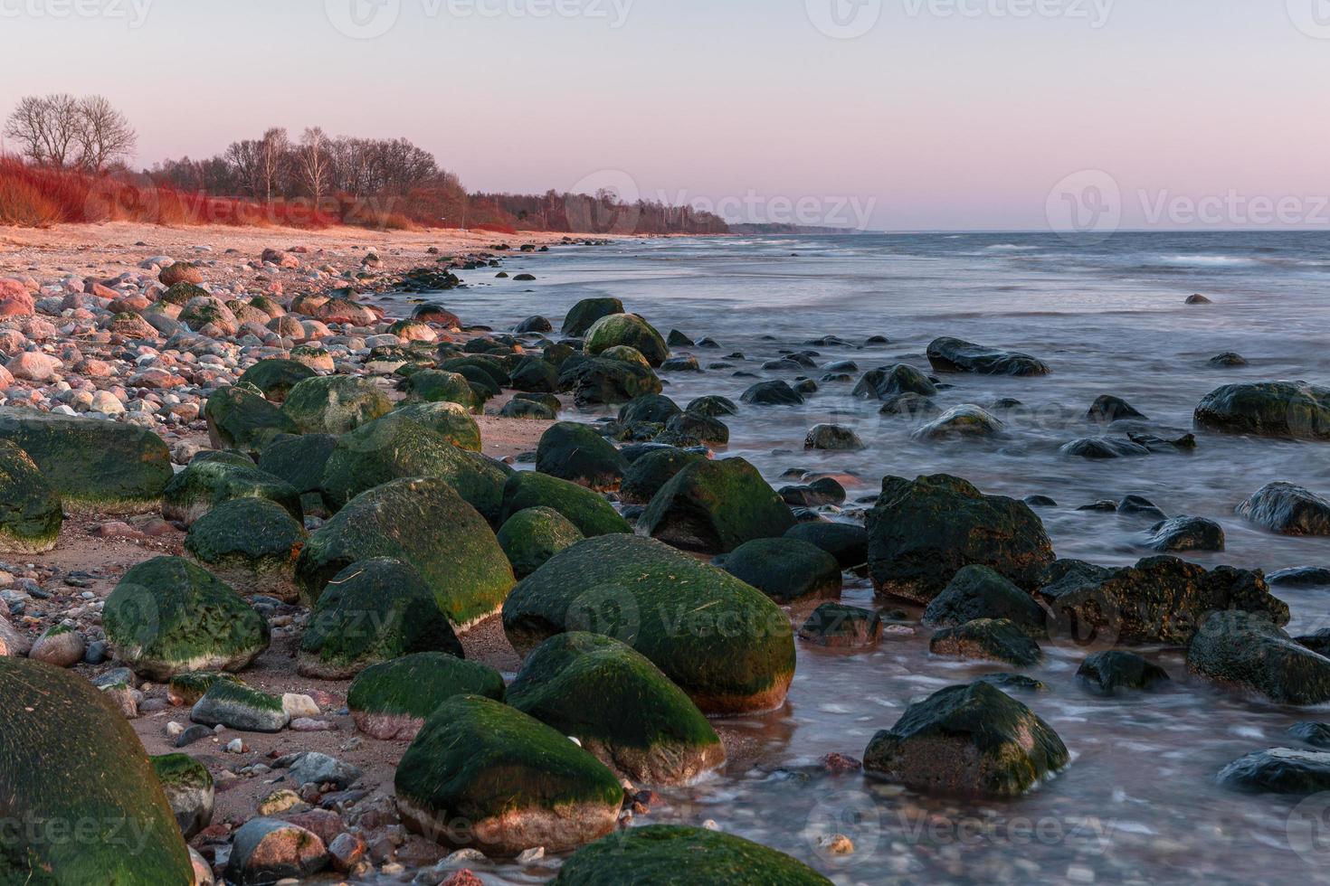 Stones on The Coast of The Baltic Sea at Sunset photo