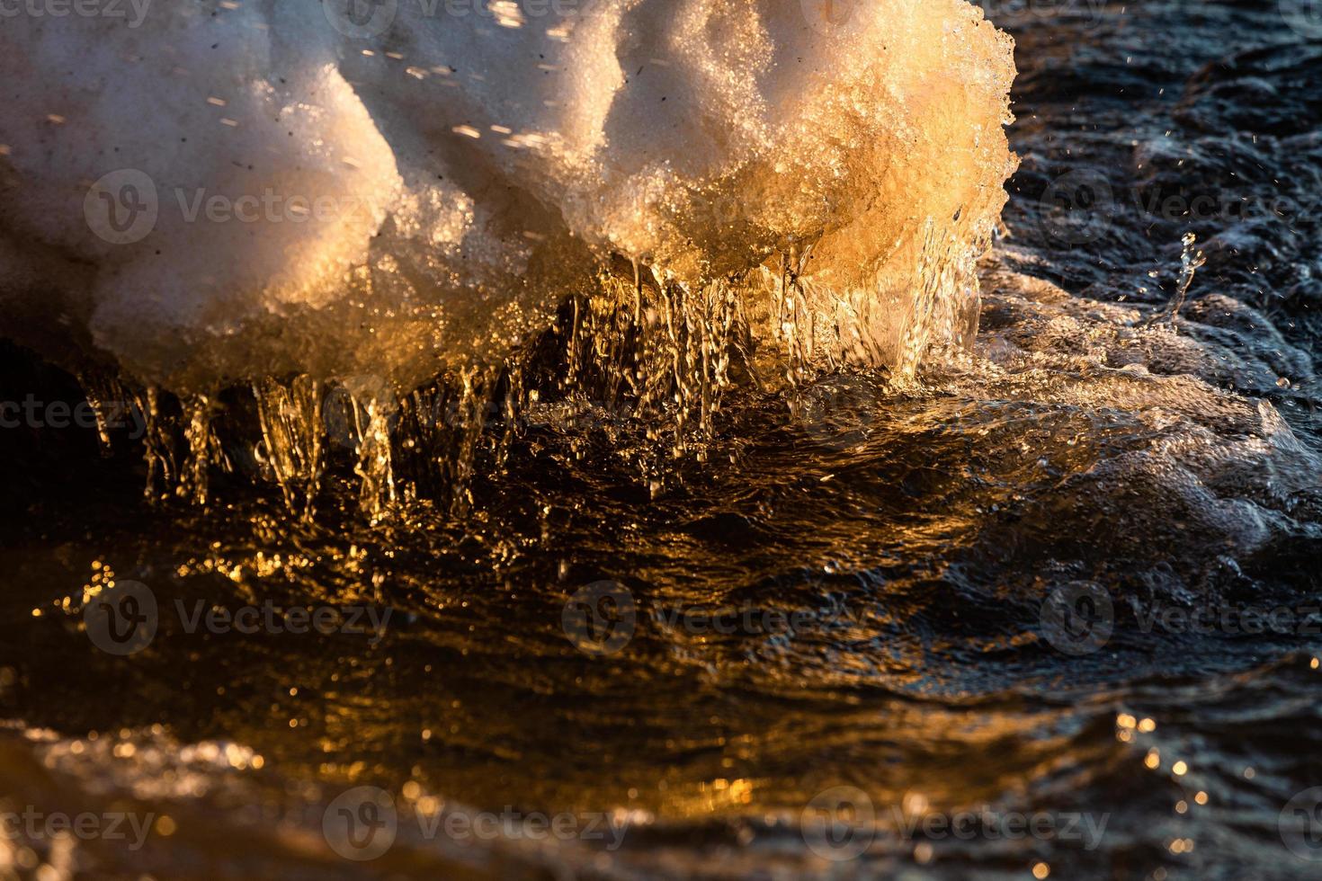 Baltic Sea Coast With Pebbles And Ice at Sunset photo