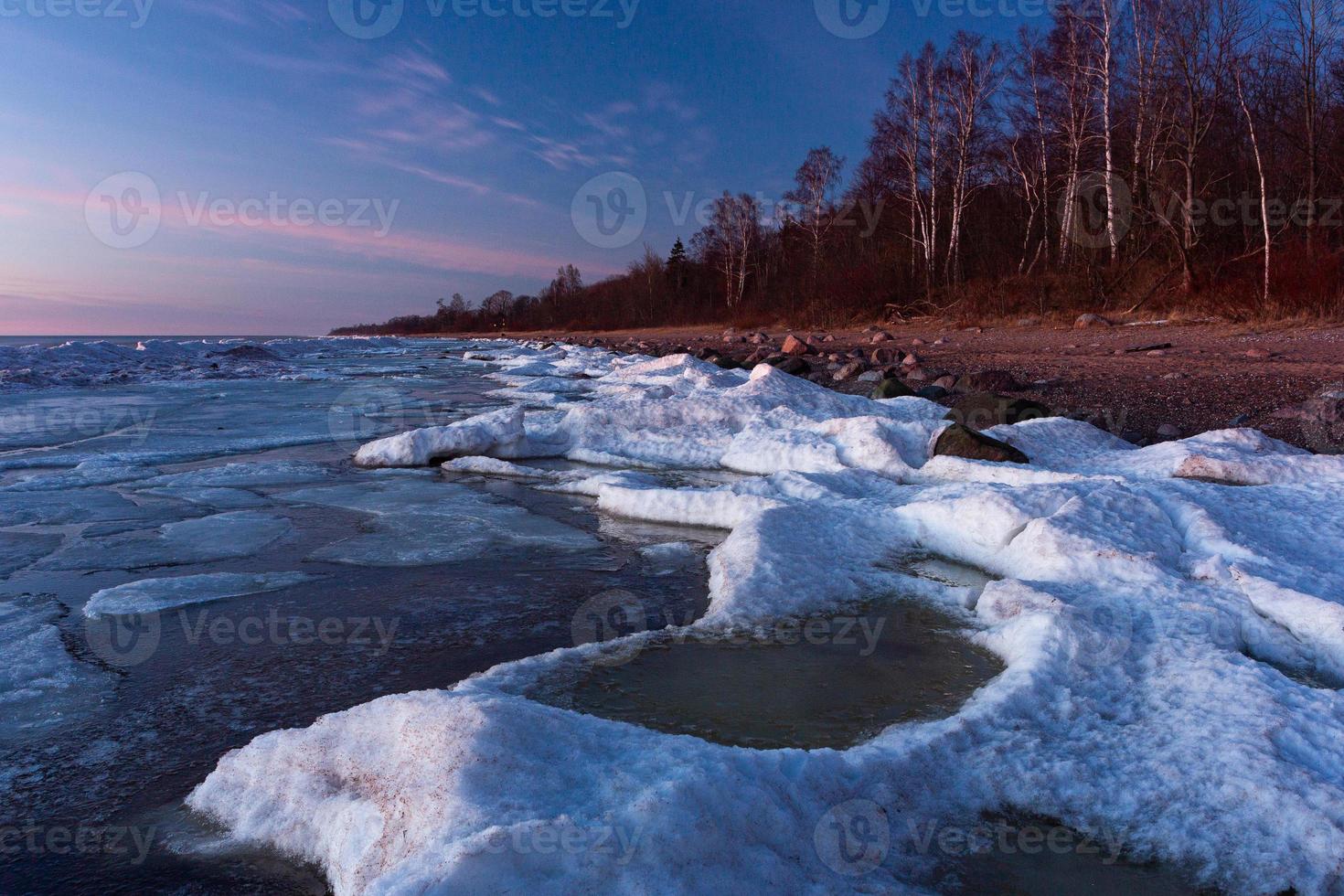 Baltic Sea Coast in Winter With Ice at Sunset photo