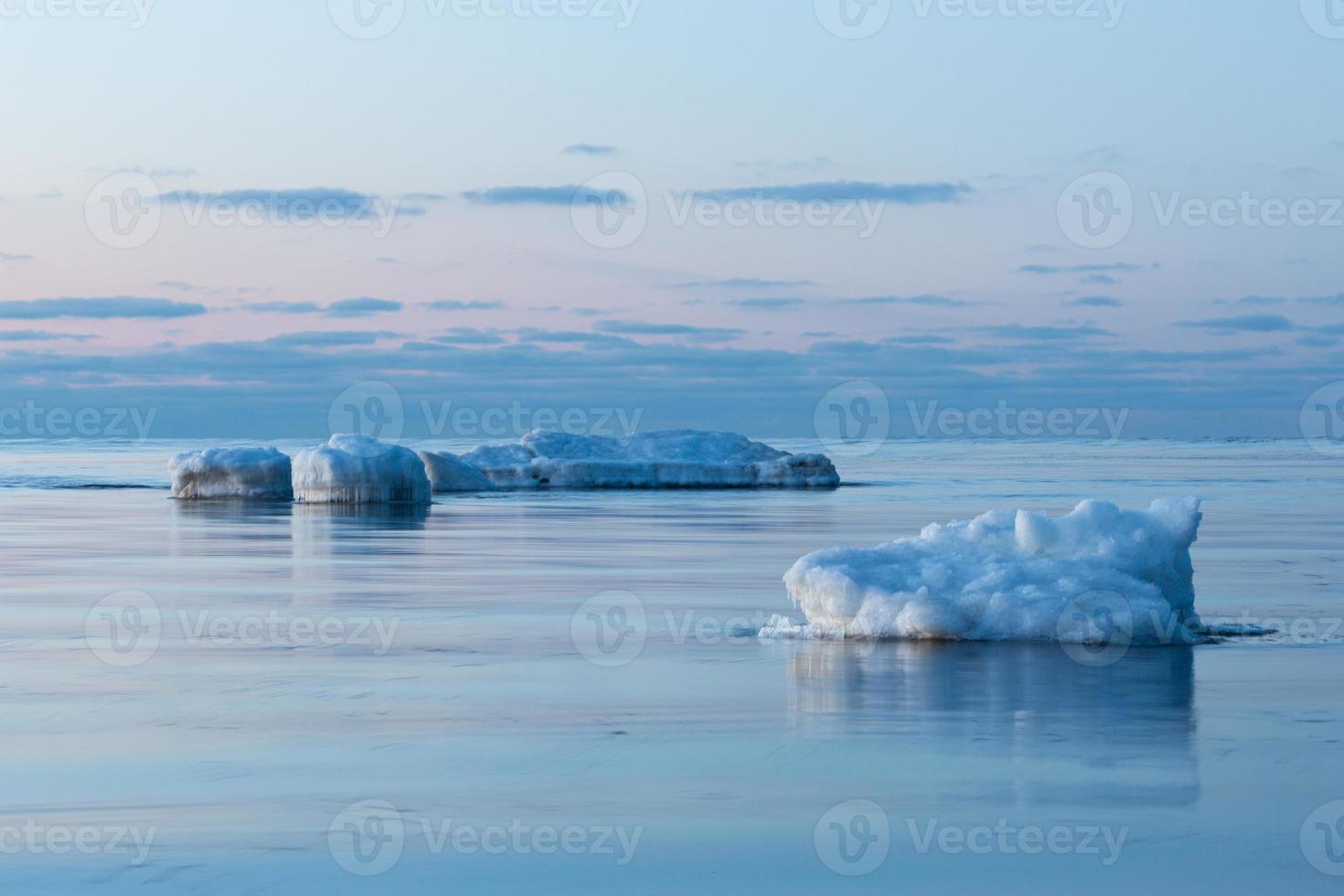 Baltic Sea Coast in Winter With Ice at Sunset photo