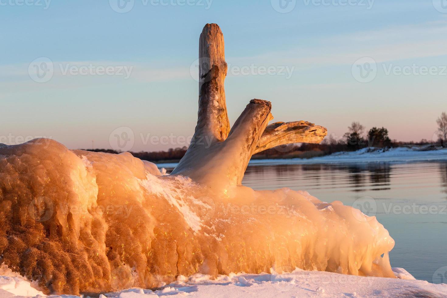 Baltic Sea Coast in Winter With Ice at Sunset photo