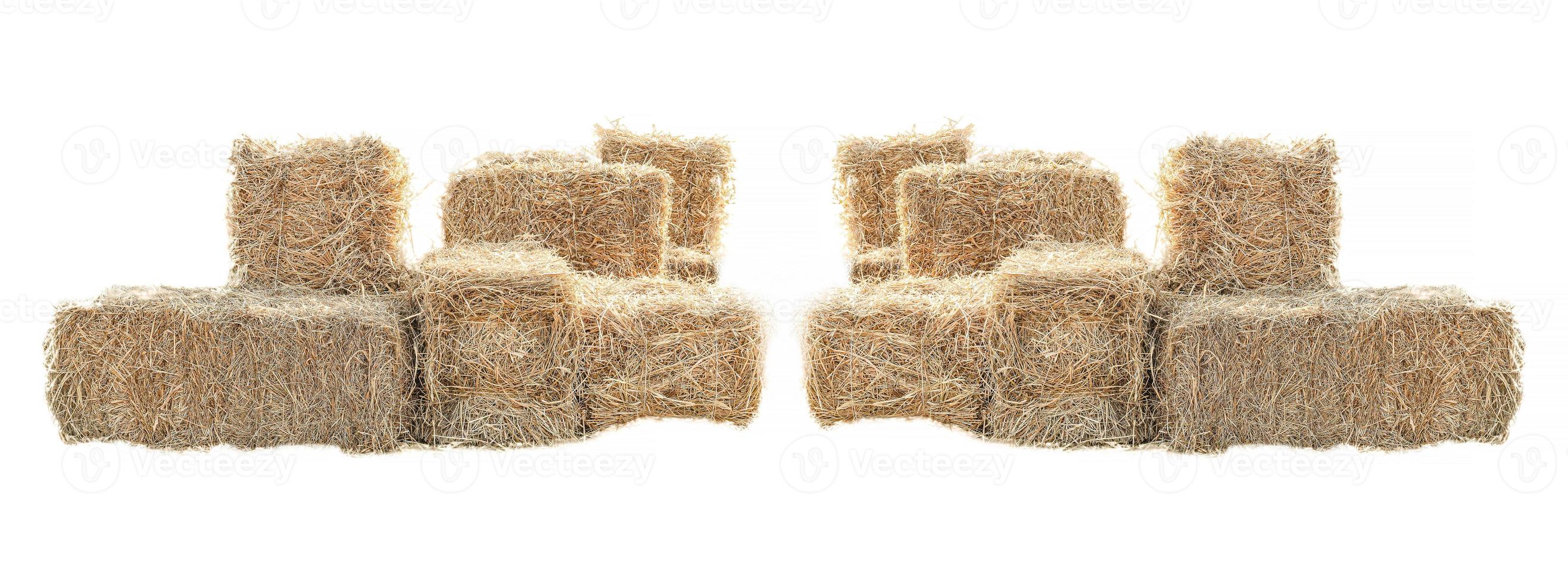 Golden yellow haystack isolated on a white background hay is a tightly joined bale of straw. photo
