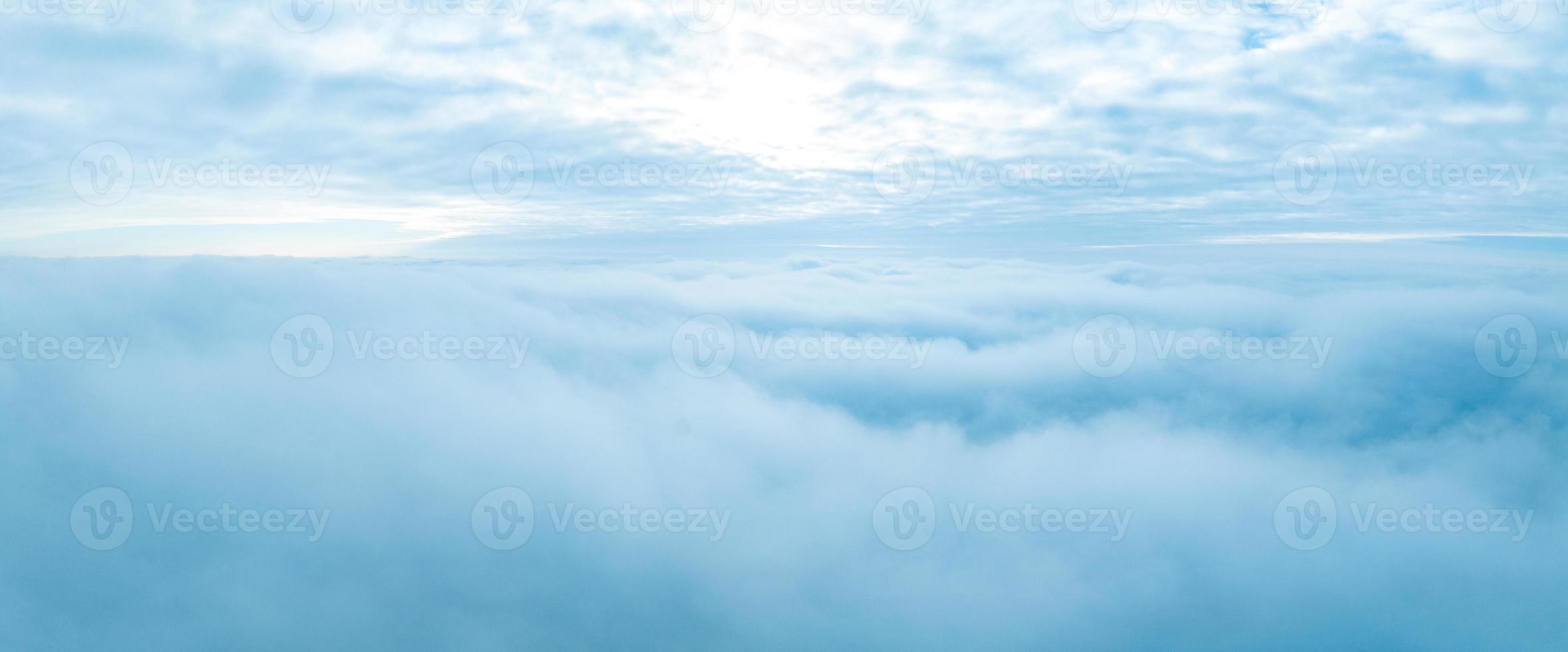 Flying above the stormy clouds. Aerial close up cloud view. photo