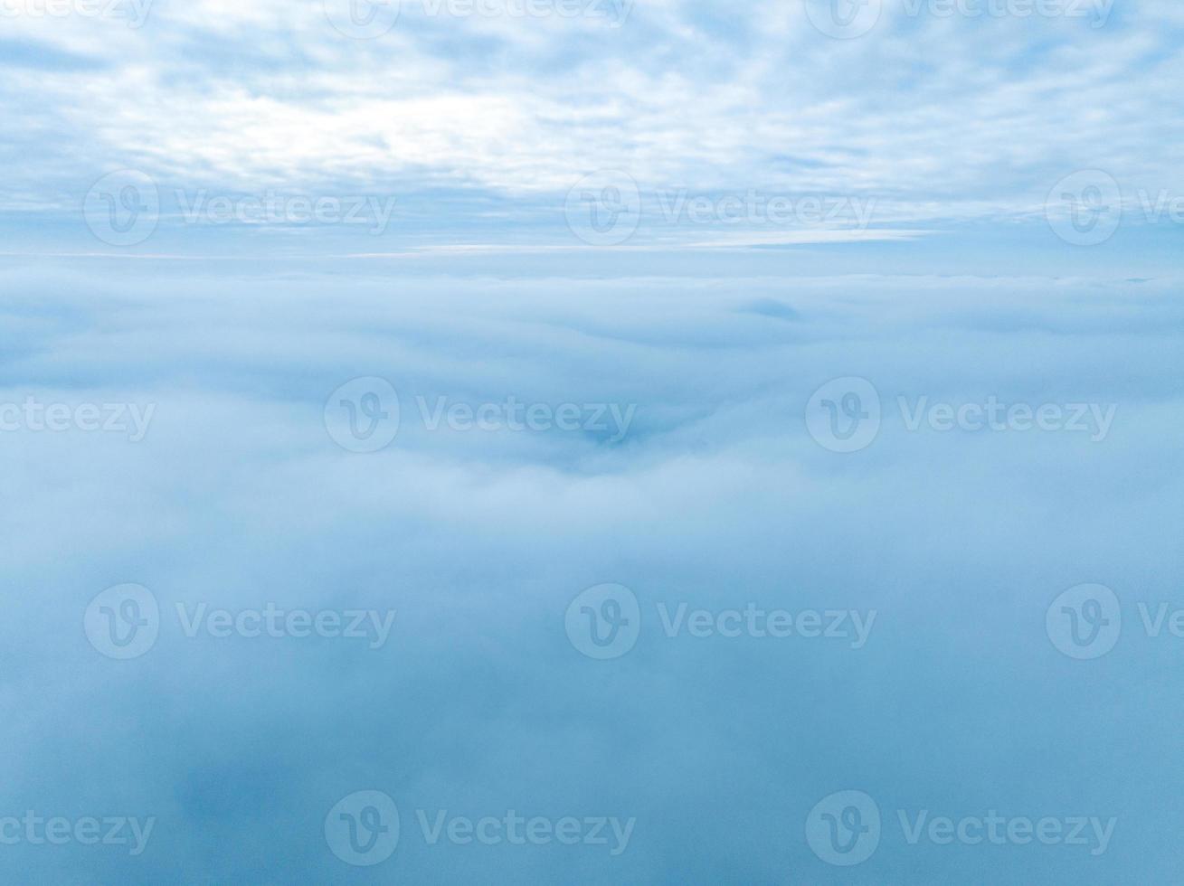 Flying above the stormy clouds. Aerial close up cloud view. photo