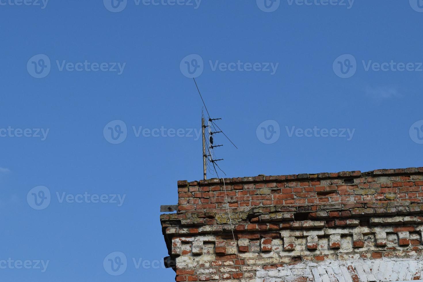 The television antenna on the rooftop photo