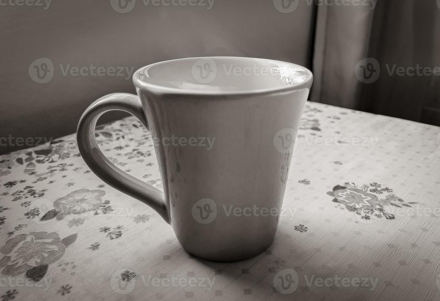 Red cup of coffee on grandmas table. Angra dos Reis. photo