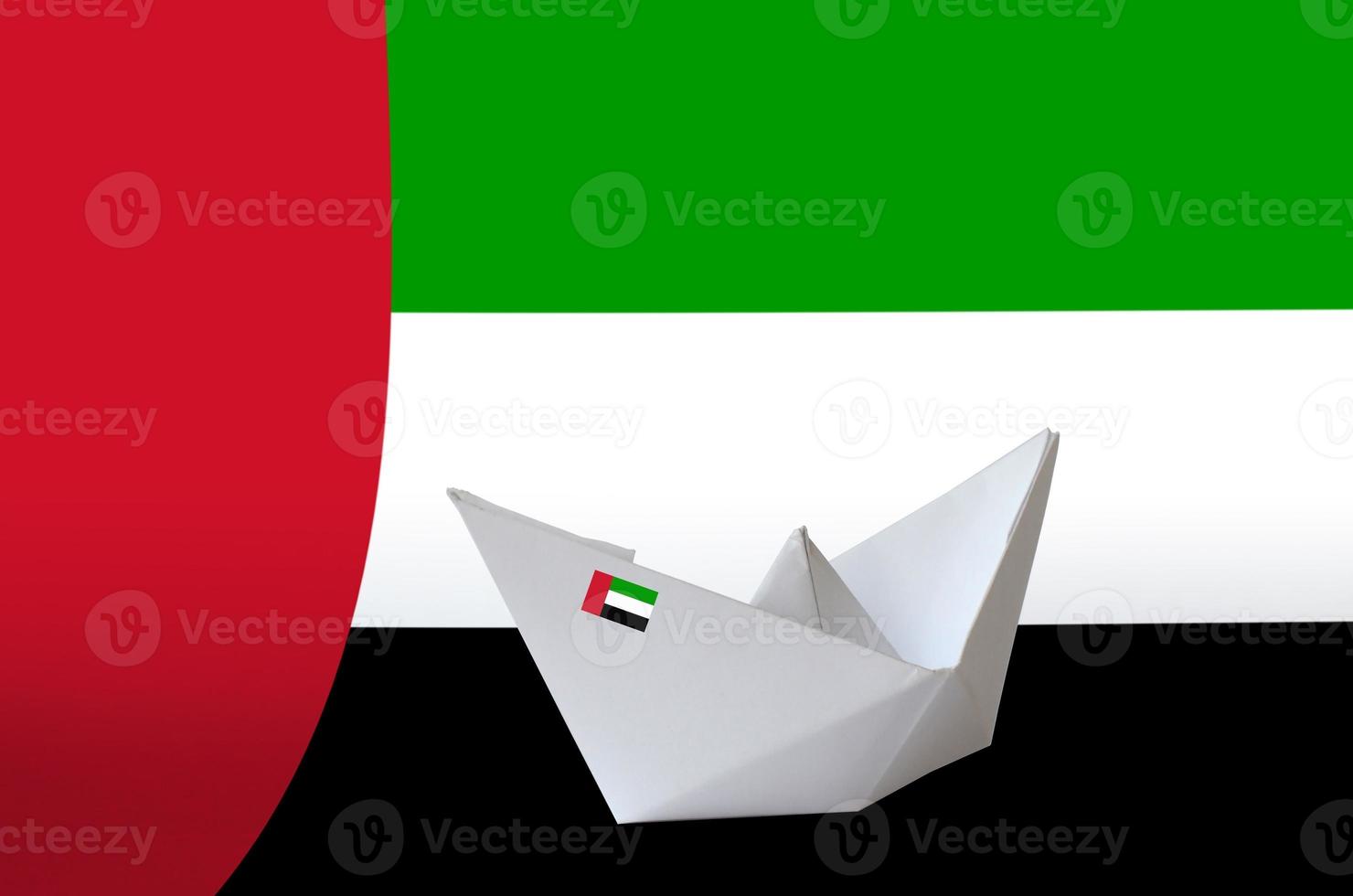 United Arab Emirates flag depicted on paper origami ship closeup. Handmade arts concept photo