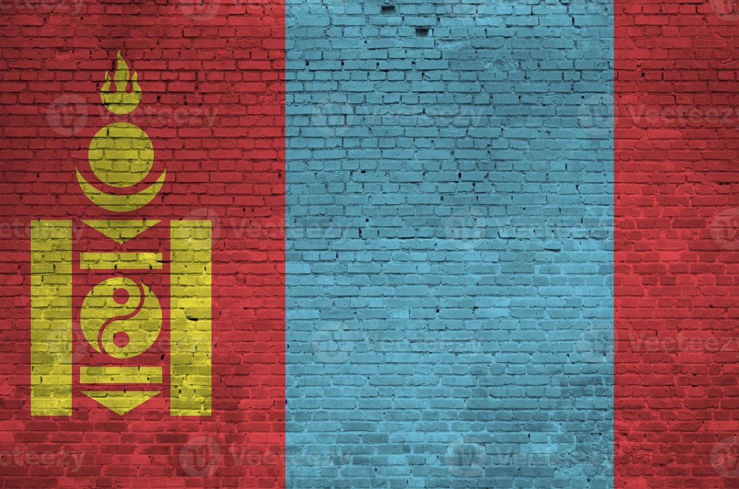 Mongolia flag depicted in paint colors on old brick wall. Textured banner on big brick wall masonry background photo