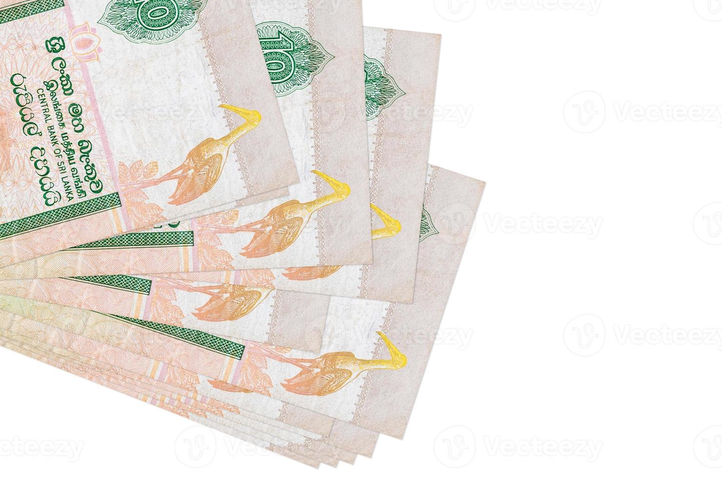 10 Sri Lankan rupees bills lies in small bunch or pack isolated on white. Mockup with copy space. Business and currency exchange photo