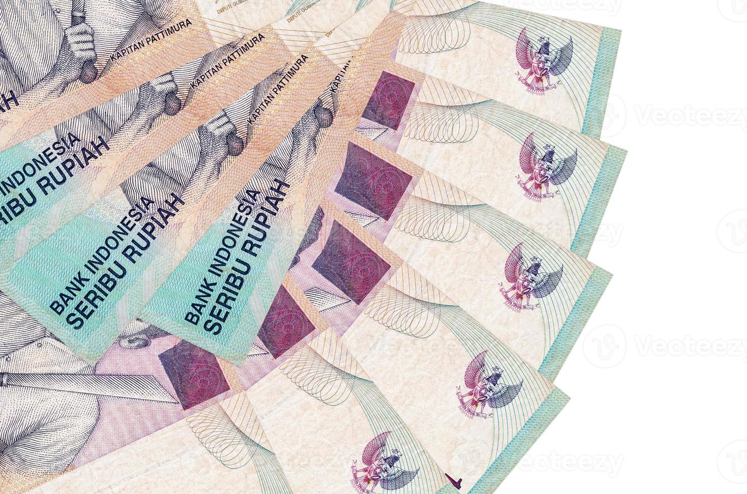 1000 Indonesian rupiah bills lies isolated on white background with copy space stacked in fan shape close up photo