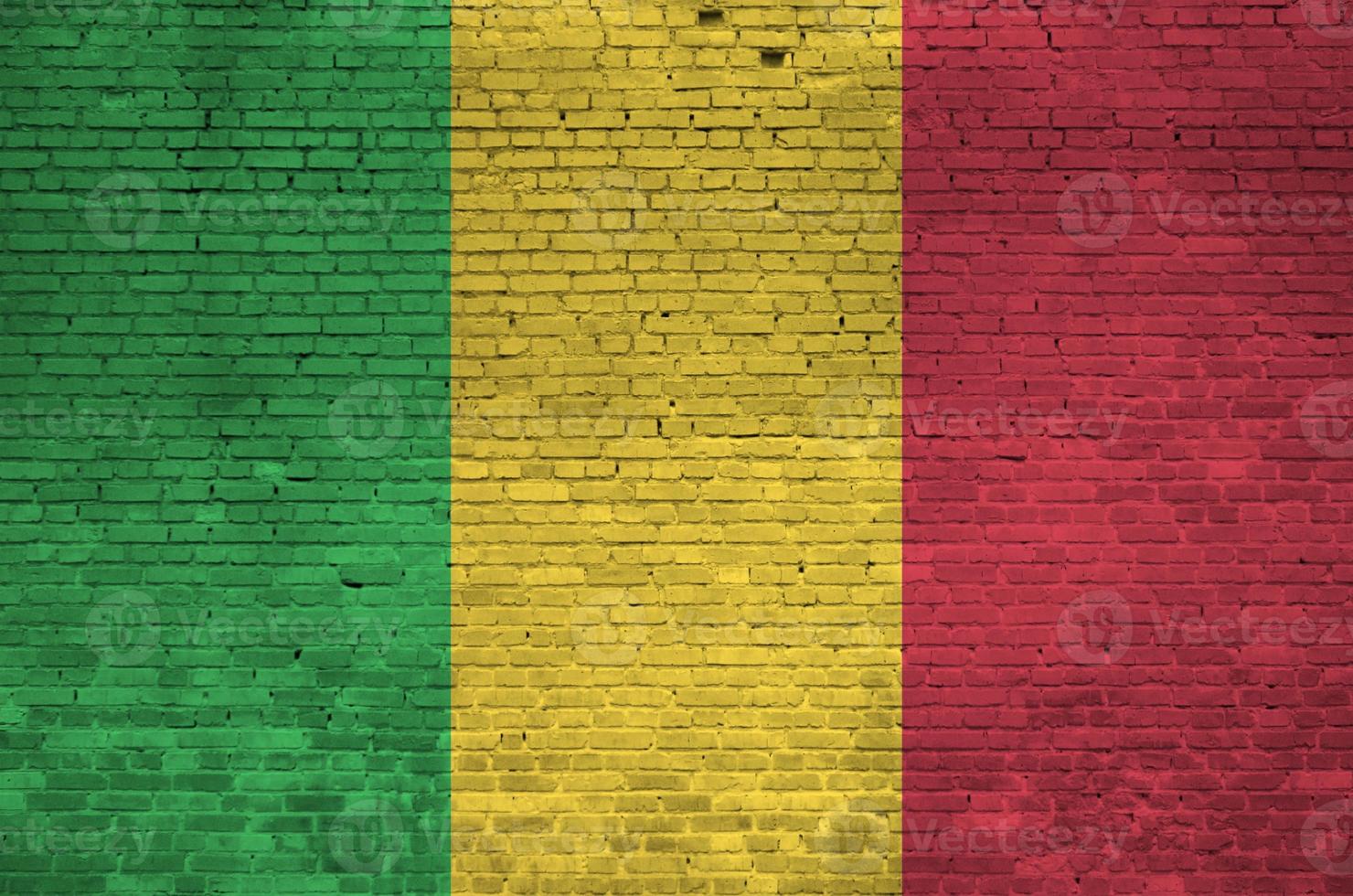 Mali flag depicted in paint colors on old brick wall. Textured banner on big brick wall masonry background photo