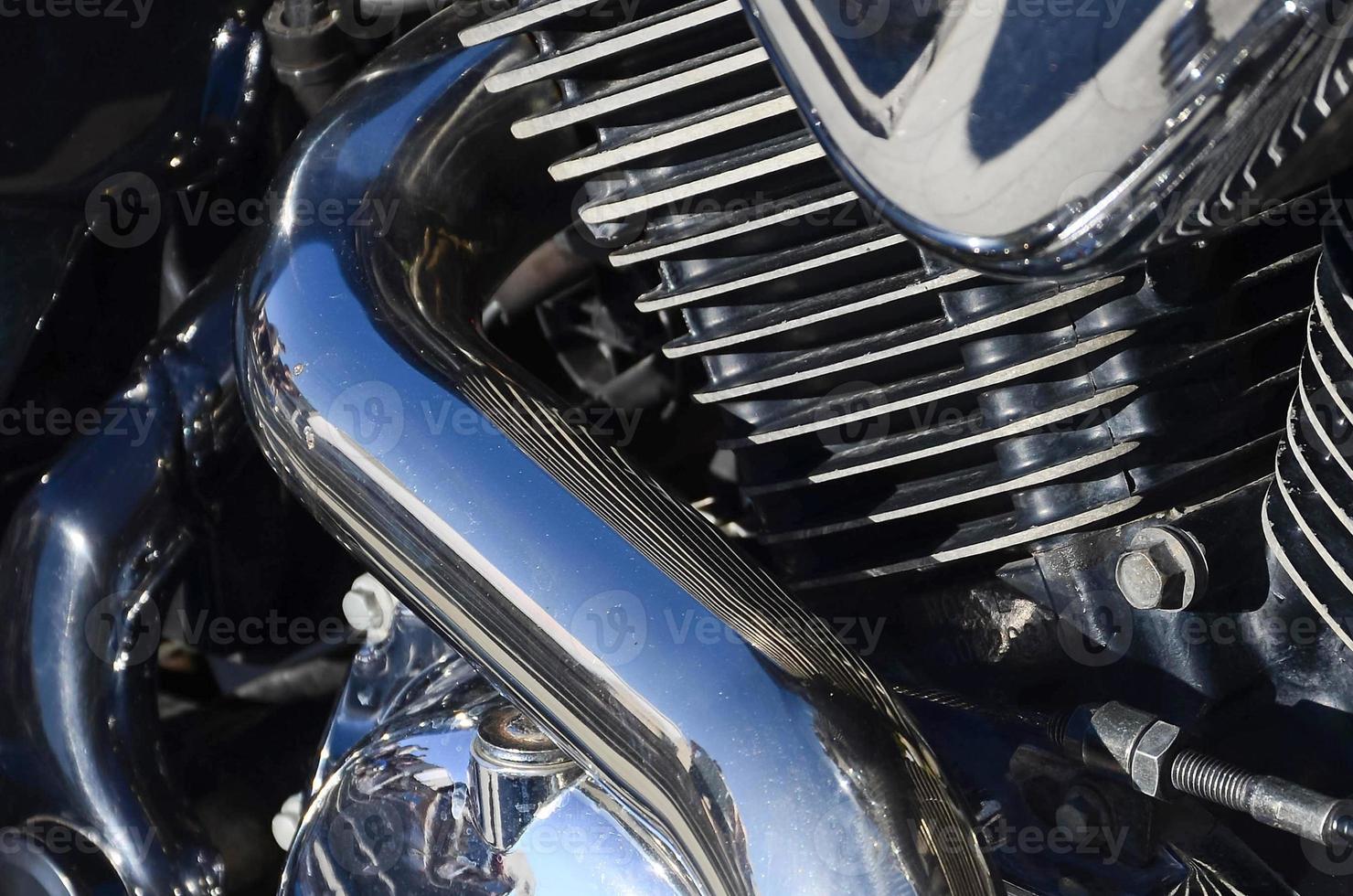 Fragment of chromed shiny body part of old classic motorbike photo