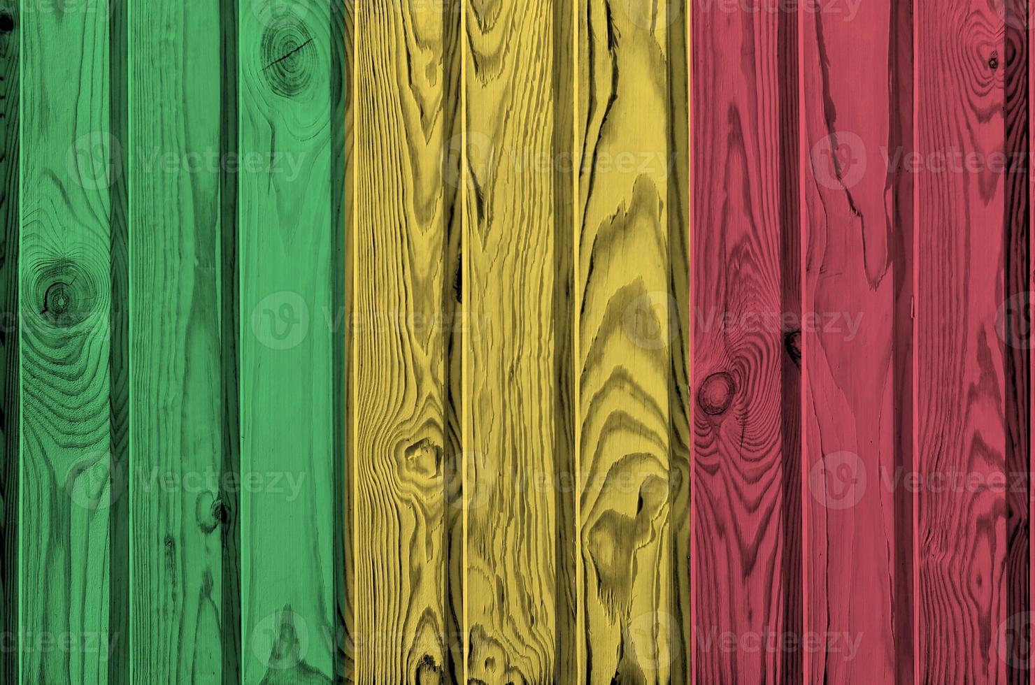 Mali flag depicted in bright paint colors on old wooden wall. Textured banner on rough background photo