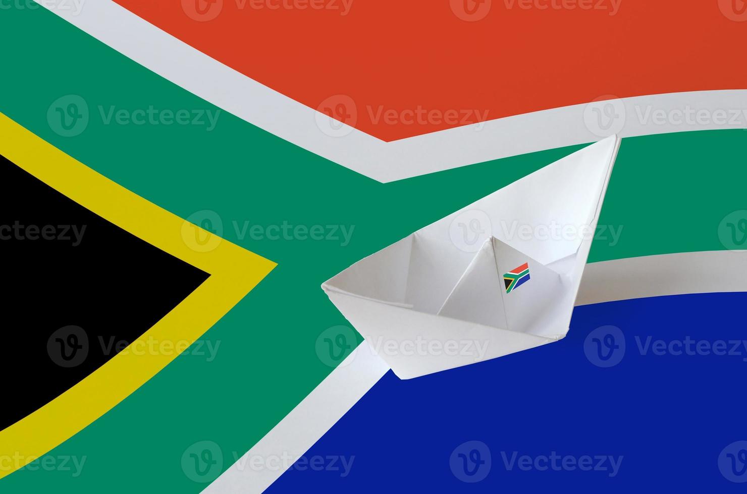 South Africa flag depicted on paper origami ship closeup. Handmade arts concept photo